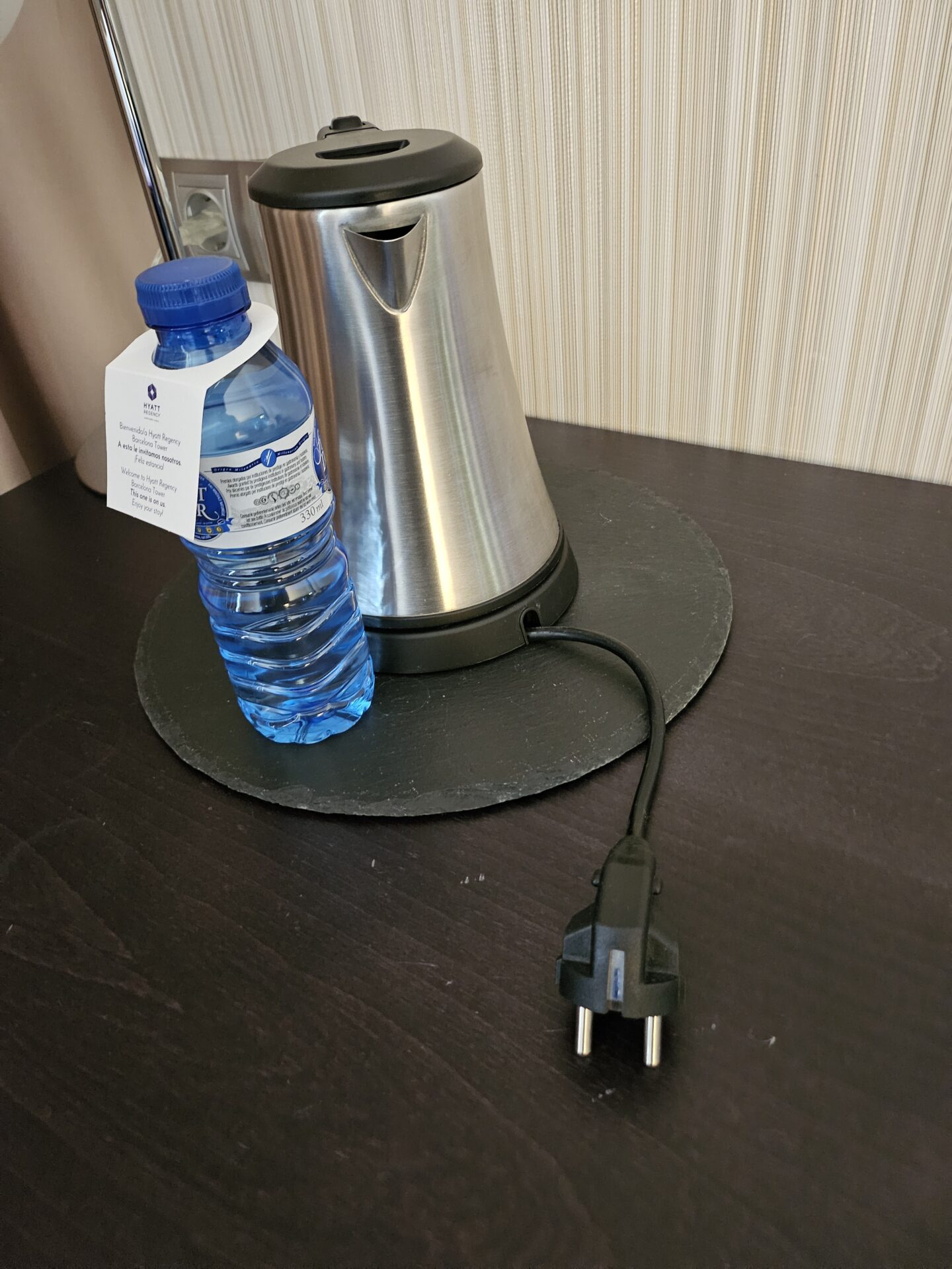 a water bottle and a kettle on a table