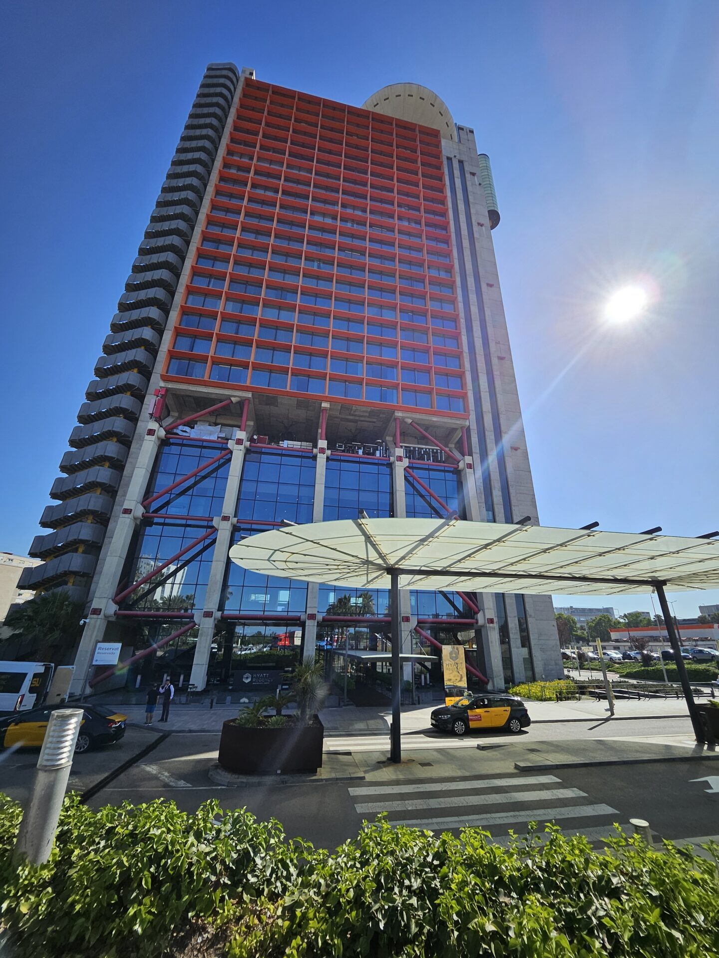 a tall building with a glass facade