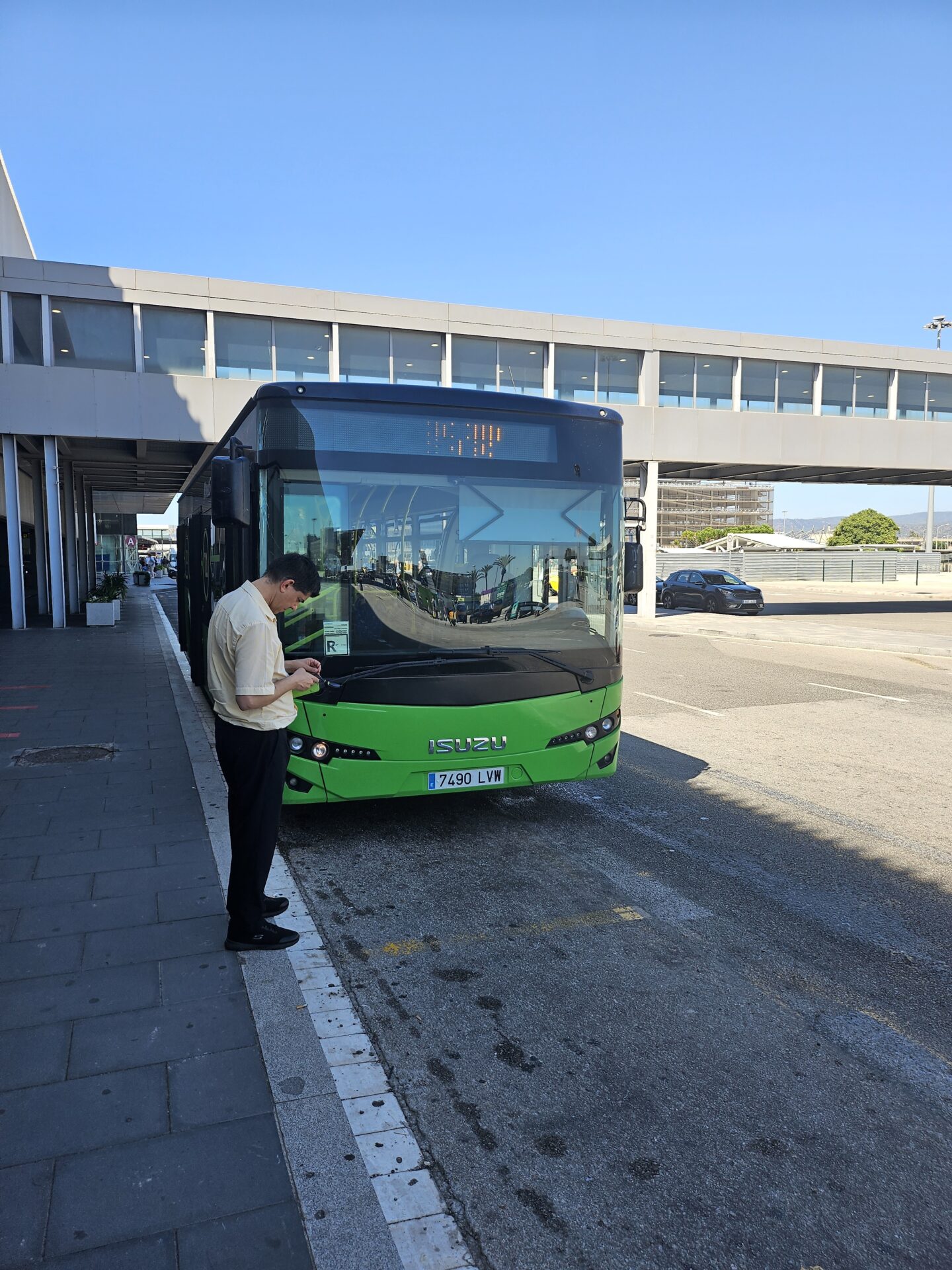 a man standing at a bus stop