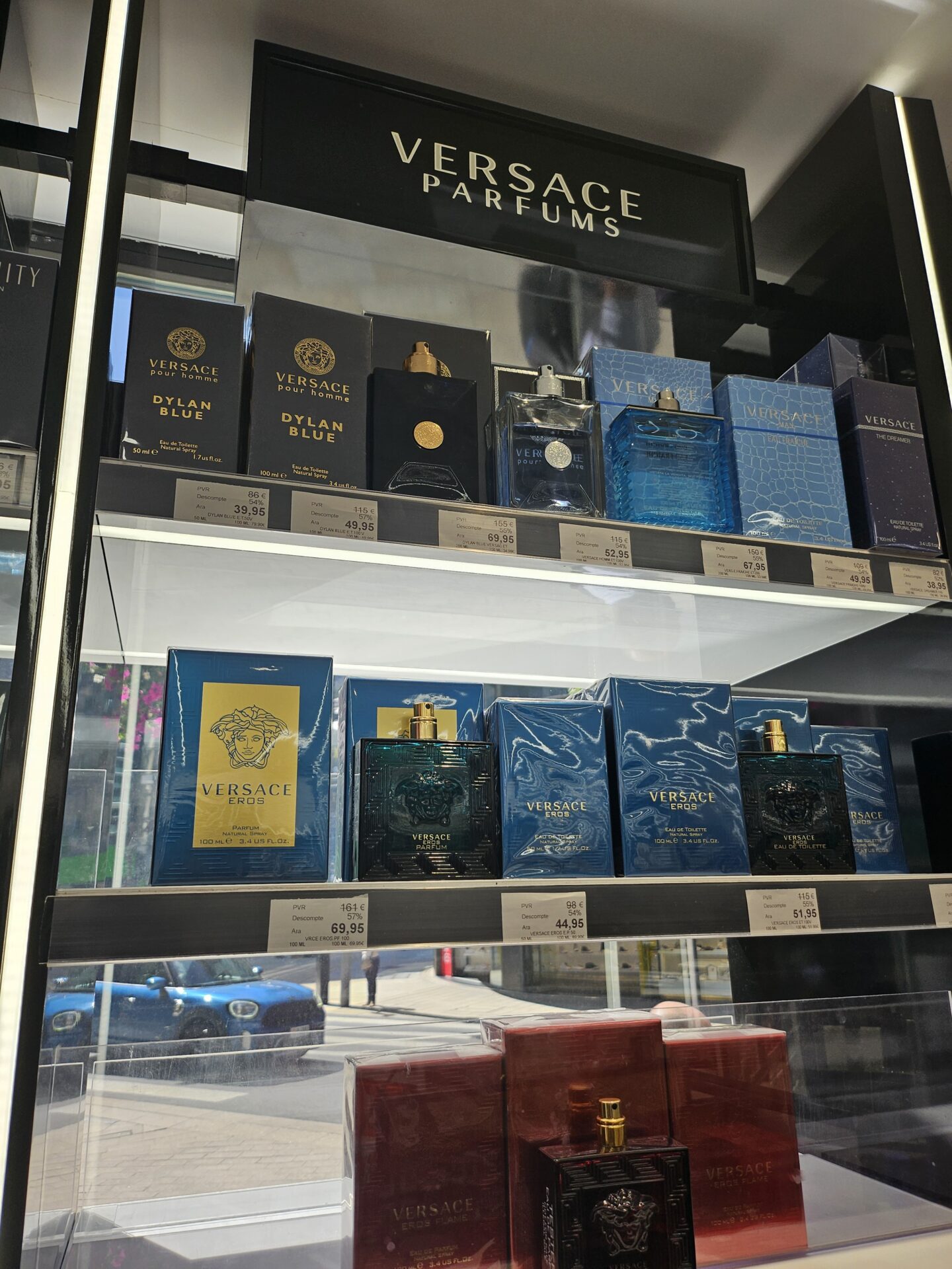 a display case with perfumes on it