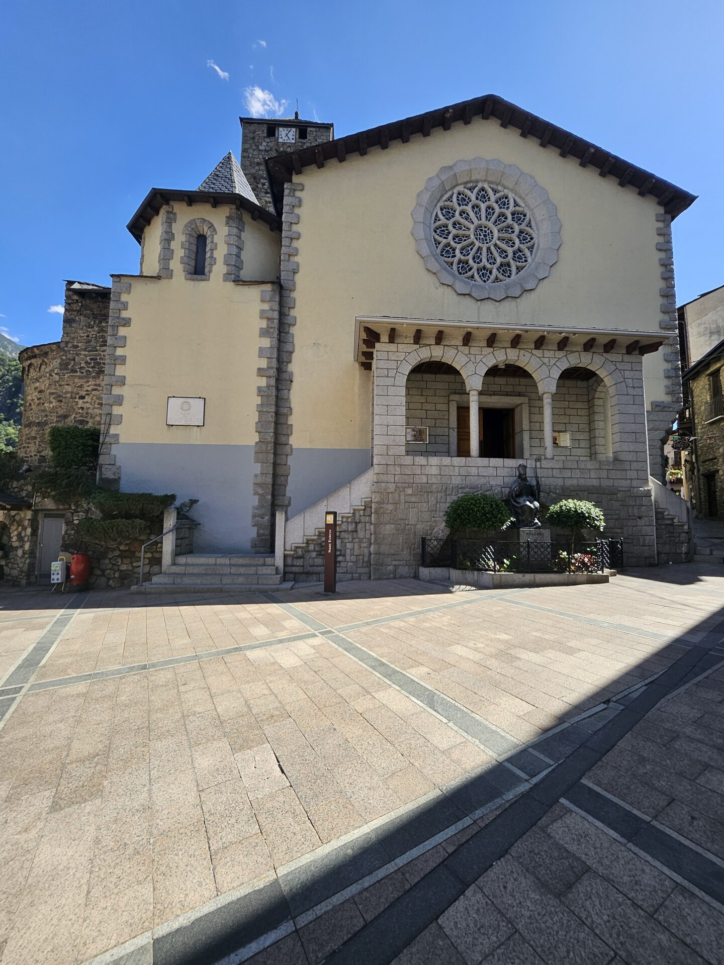 a building with a stone wall and a stone staircase