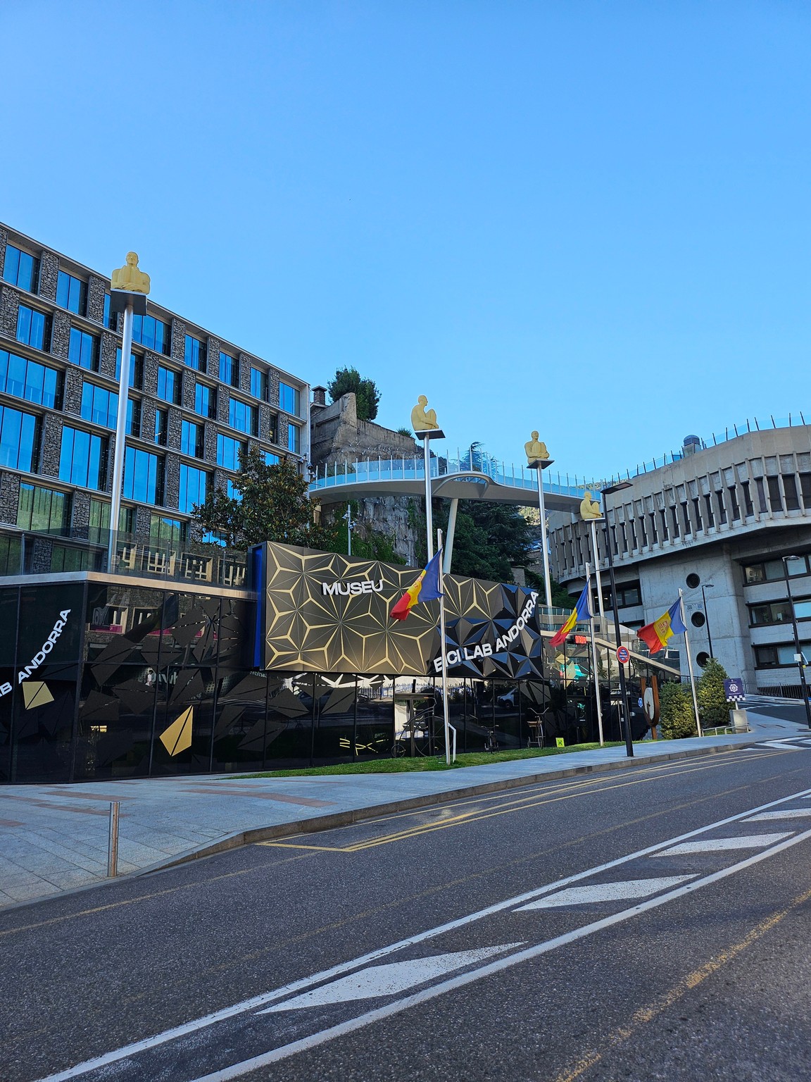 a street with flags on the side of a building