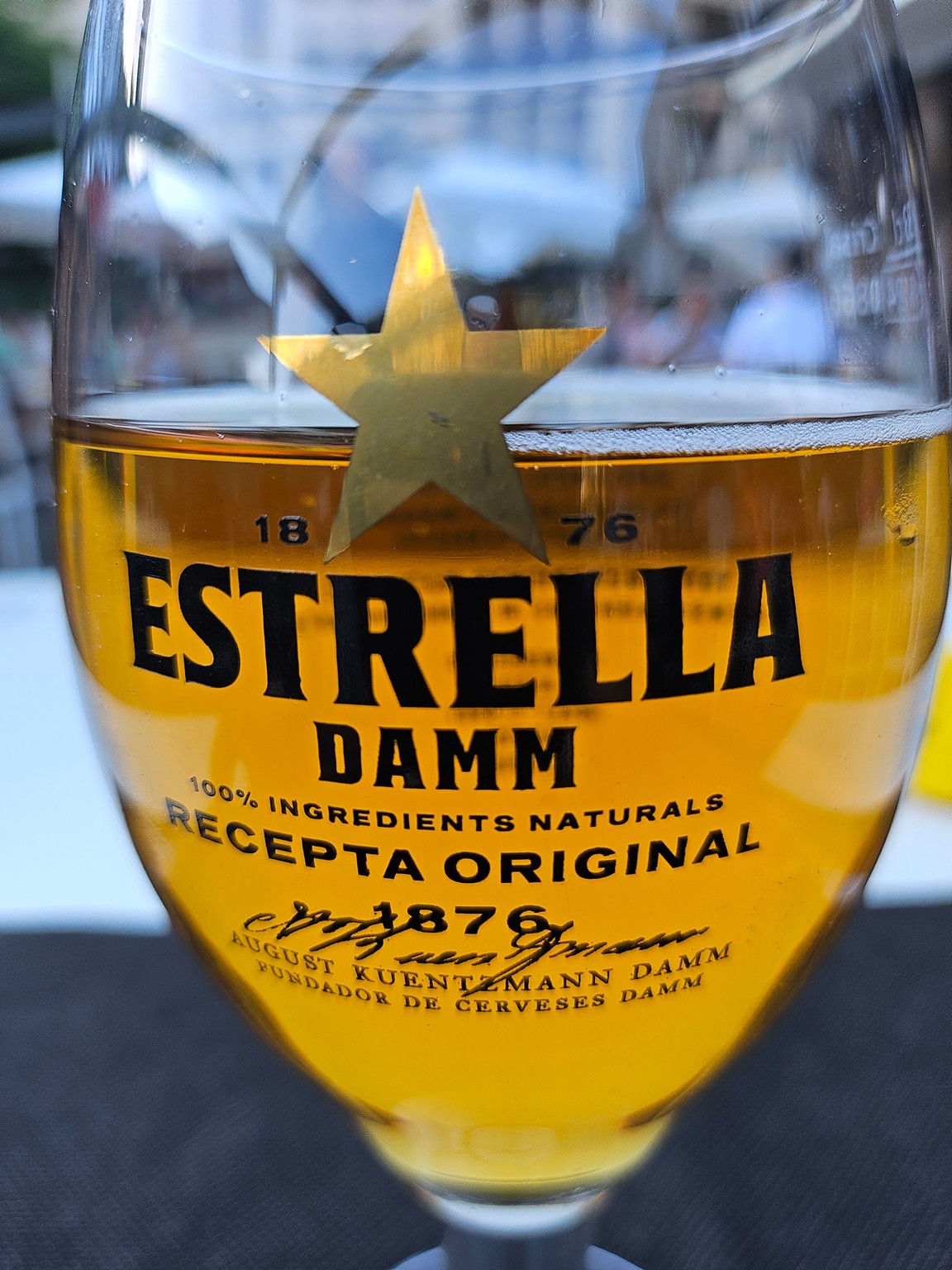 a glass of beer with a star on it