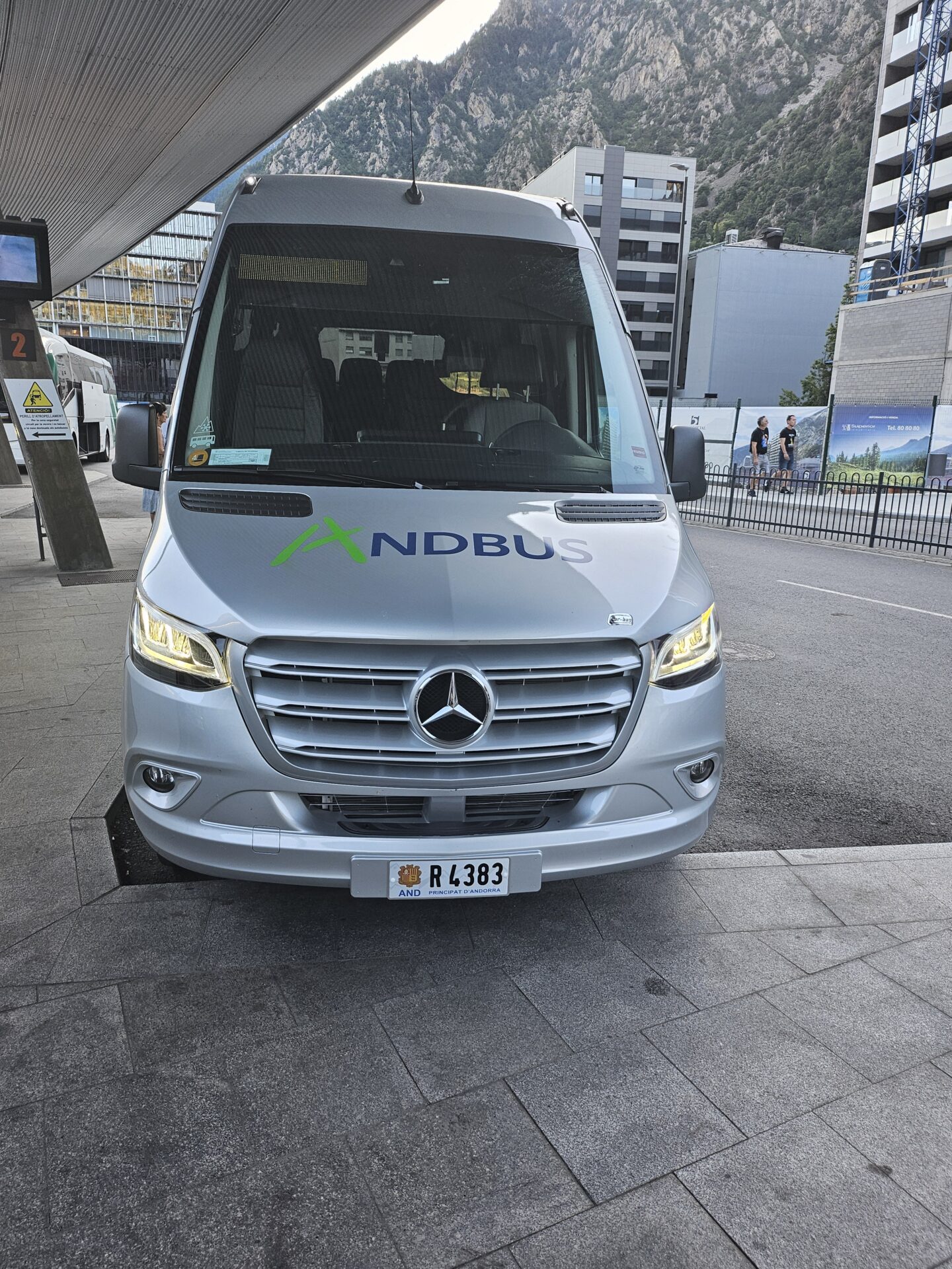 a silver van parked in front of a building