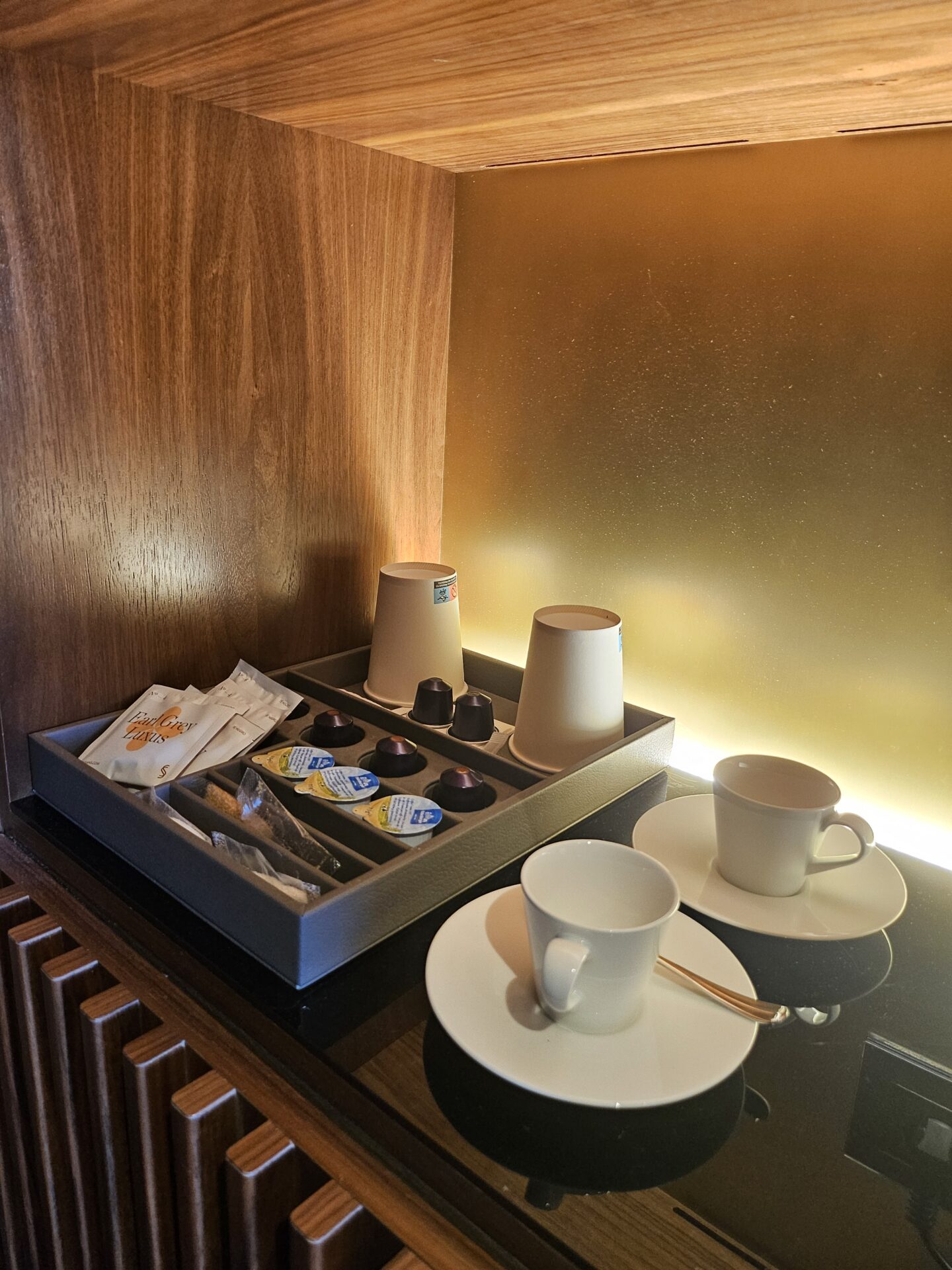 a tray of coffee cups and teacups