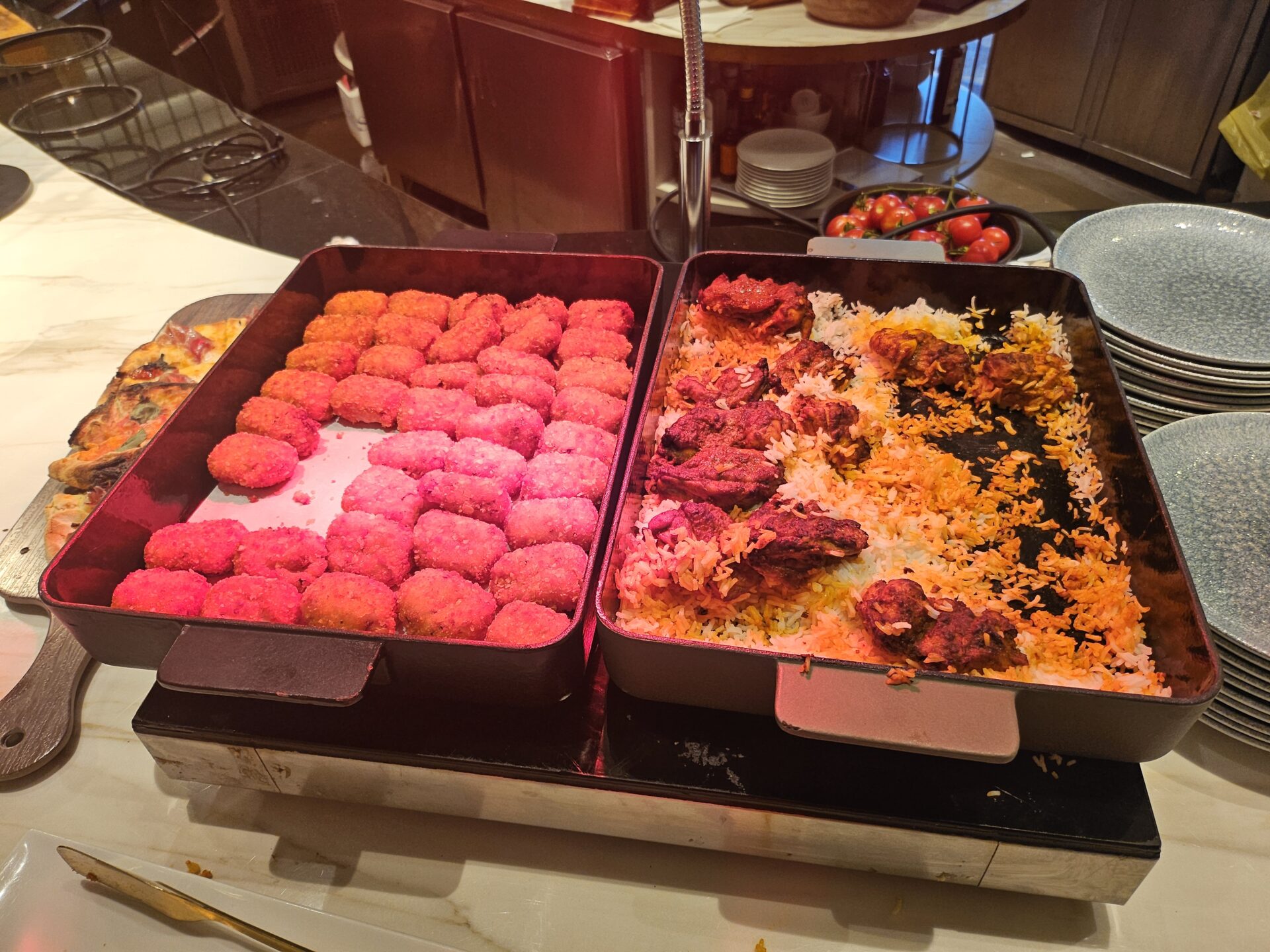 a trays of food on a counter