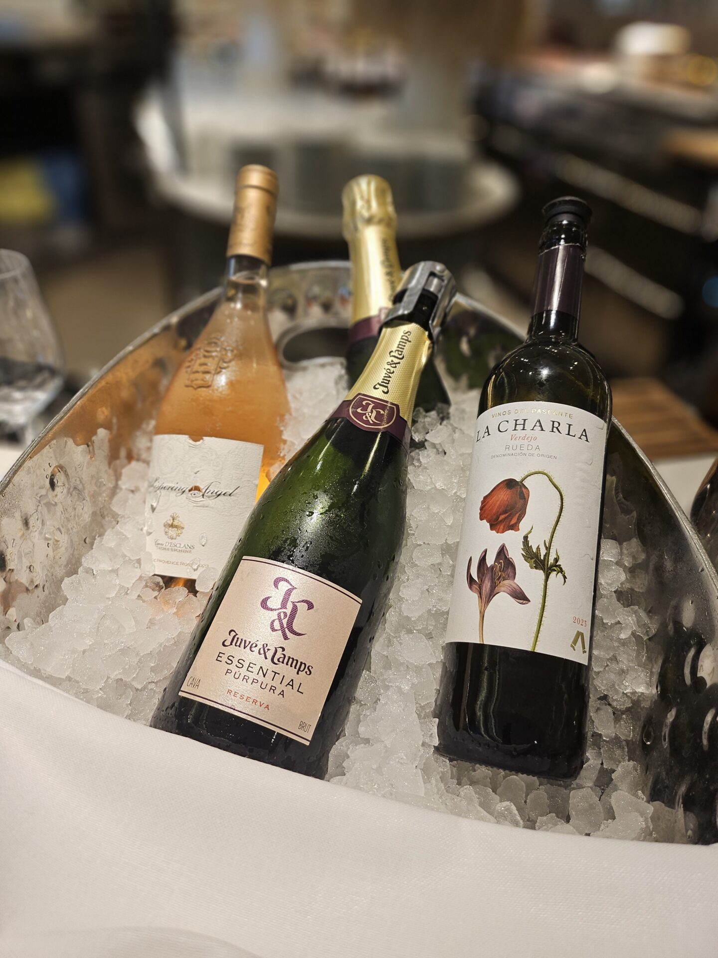 a group of bottles of wine in a bucket of ice