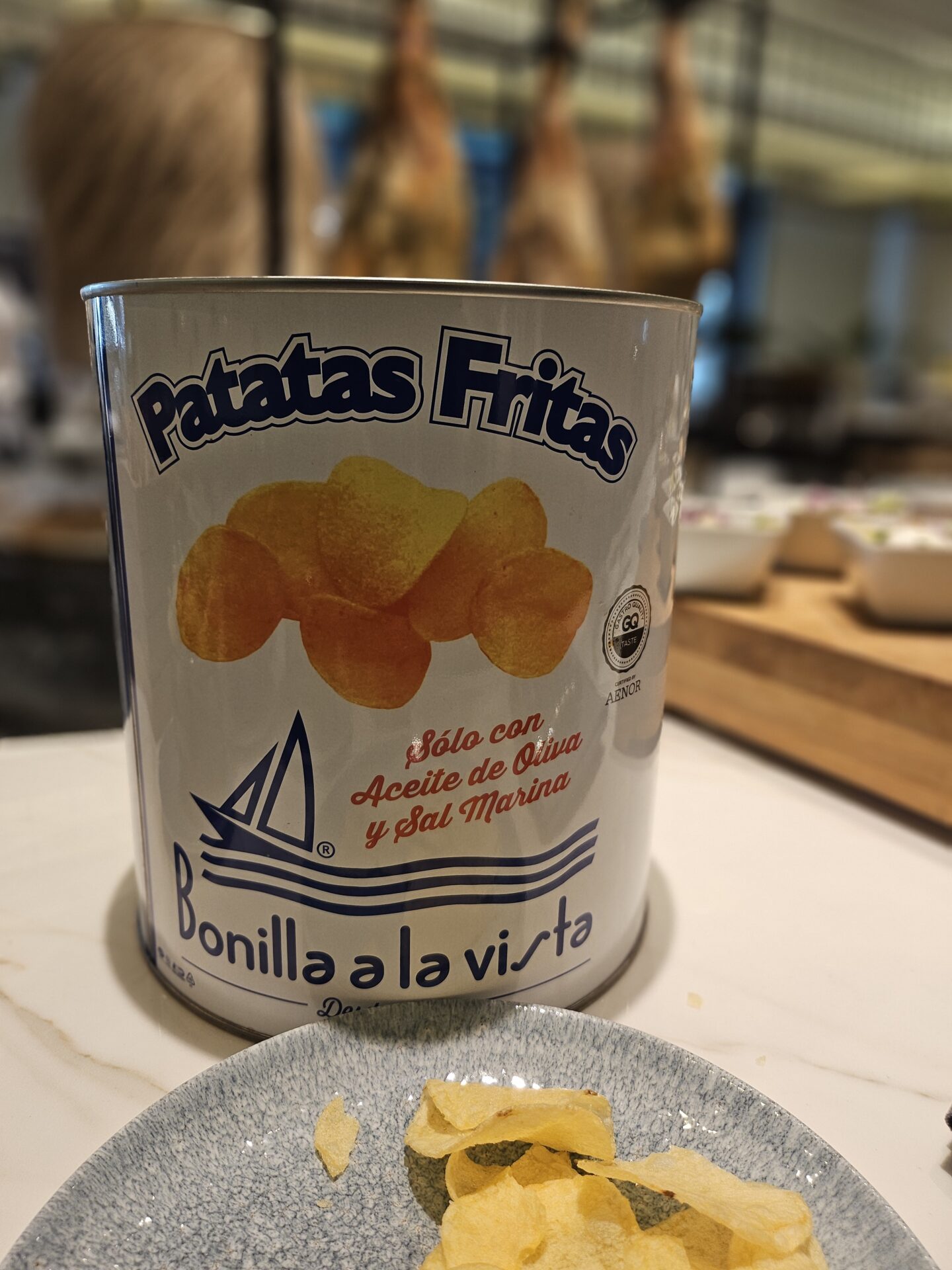 a can of potato chips on a plate