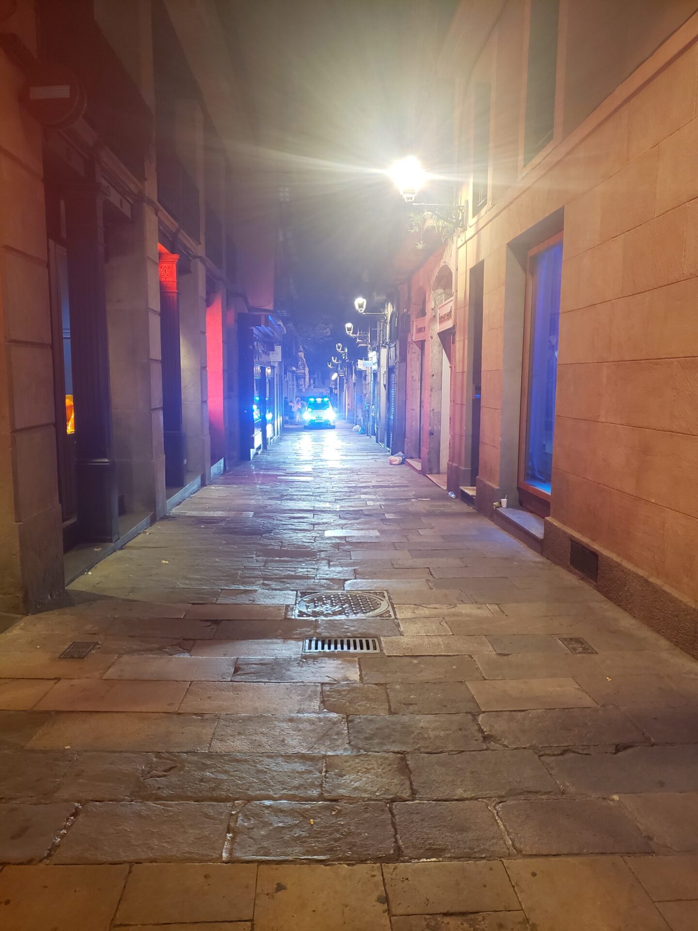 a stone walkway with lights on