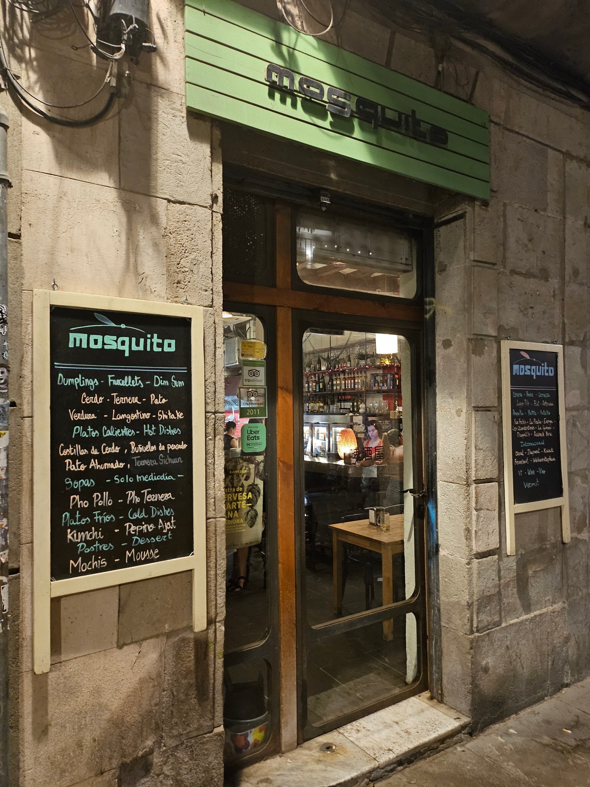 a restaurant with a sign on the door