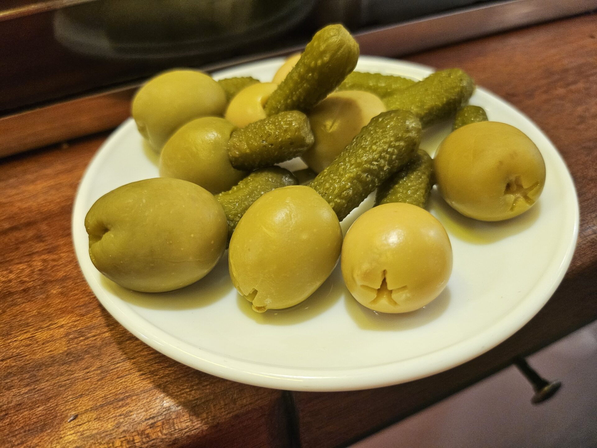 a plate of pickles and olives