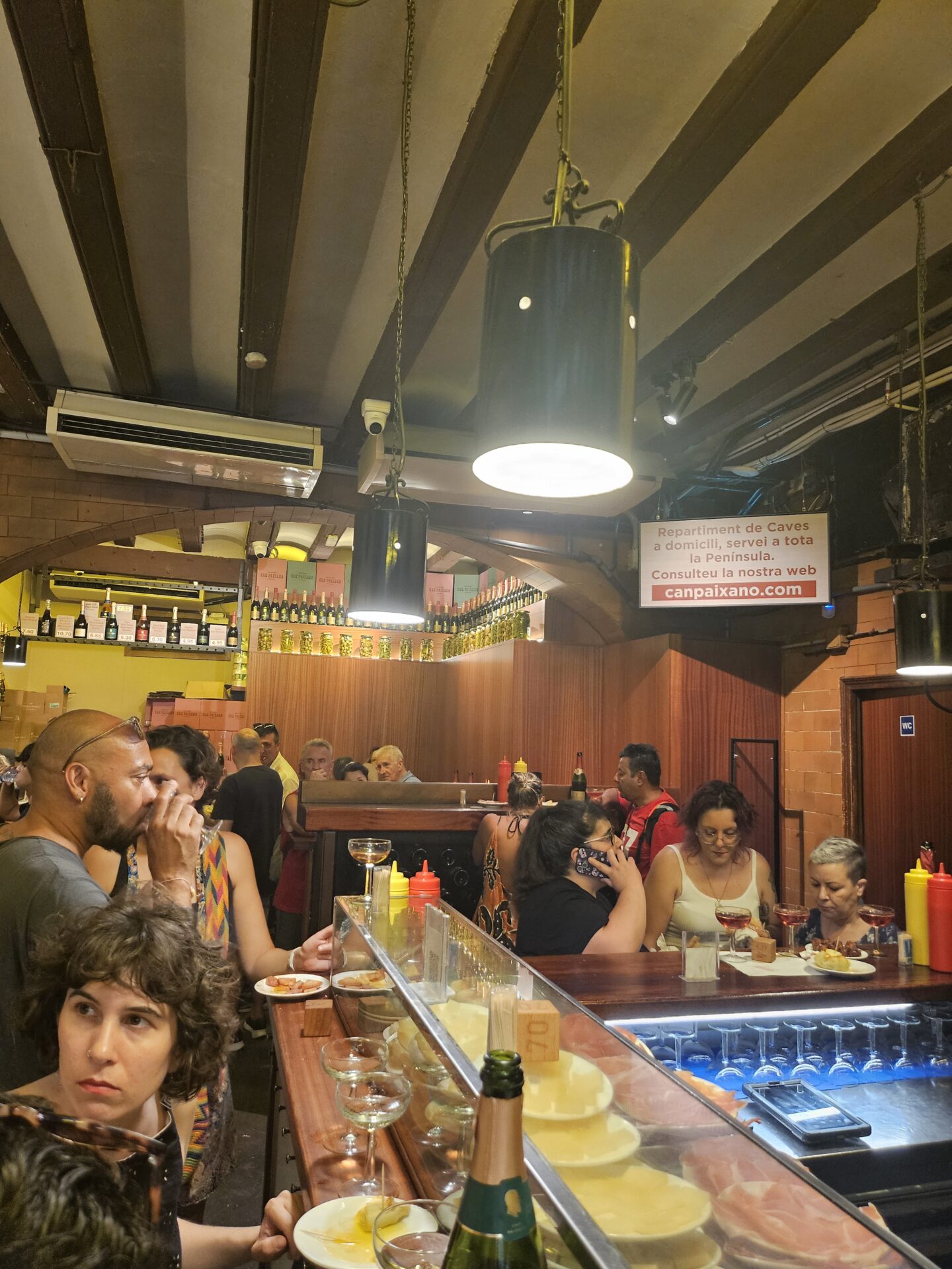 a group of people sitting at a bar