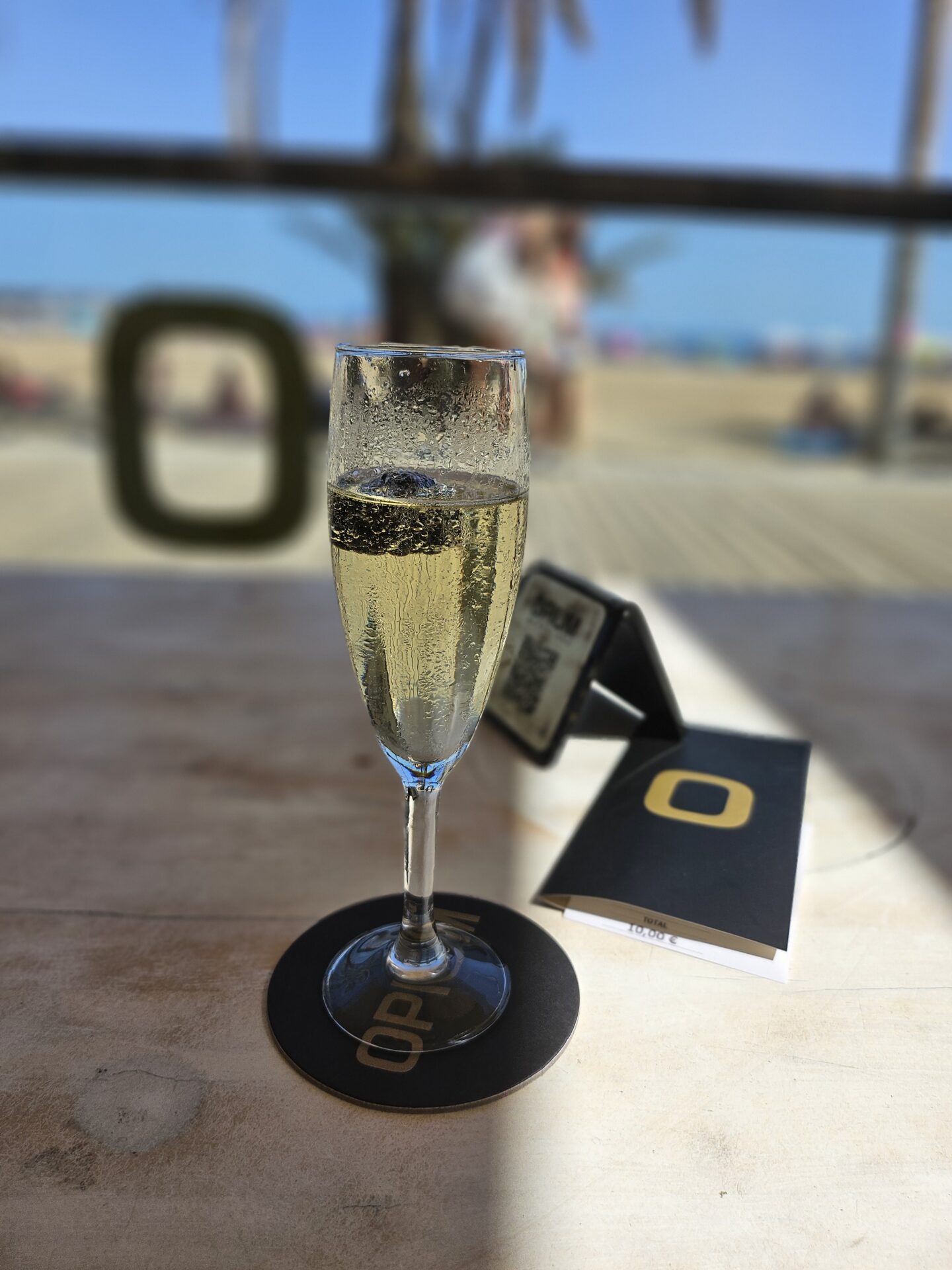 a glass of champagne on a table