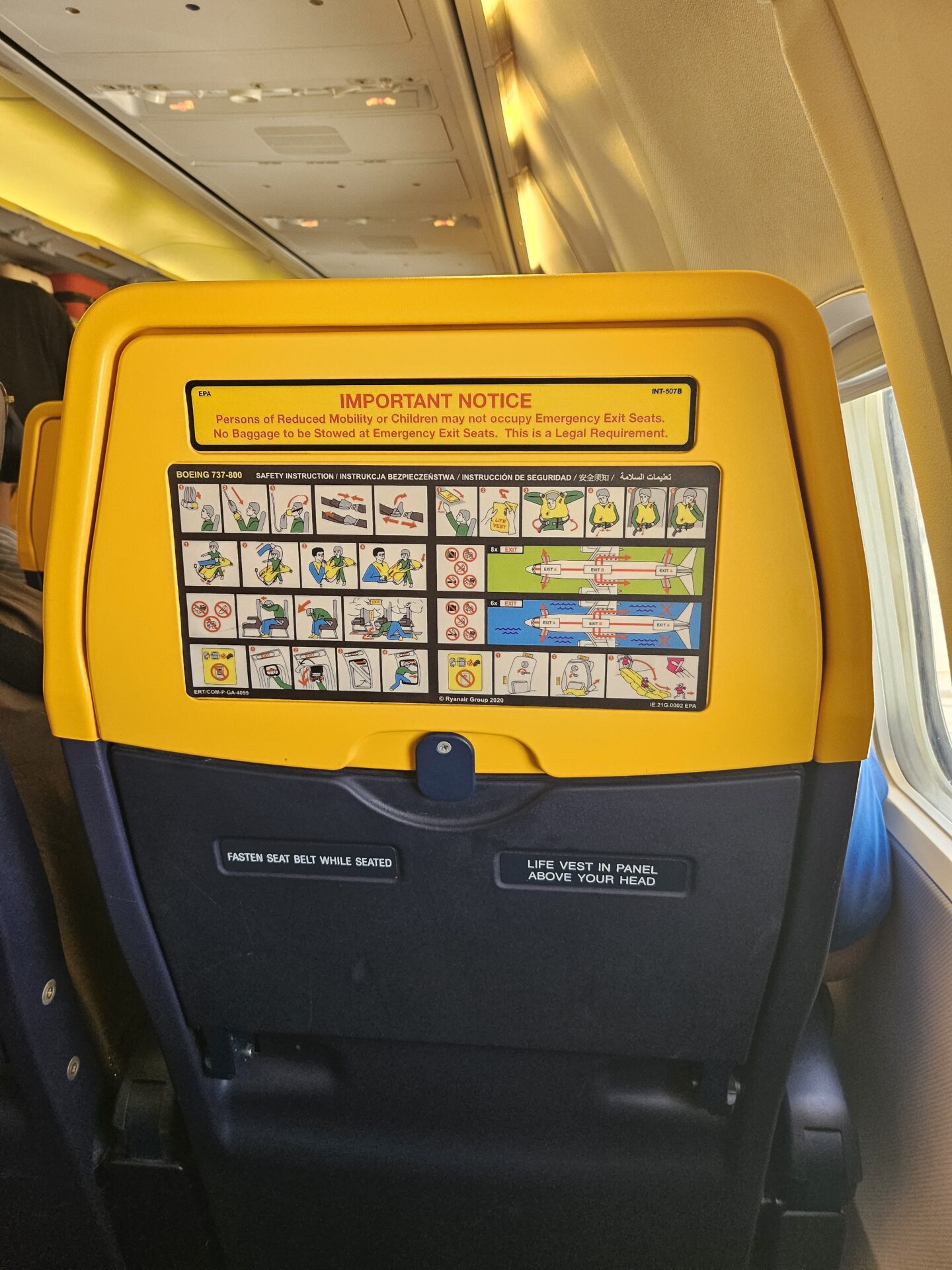 a yellow and black seat on an airplane