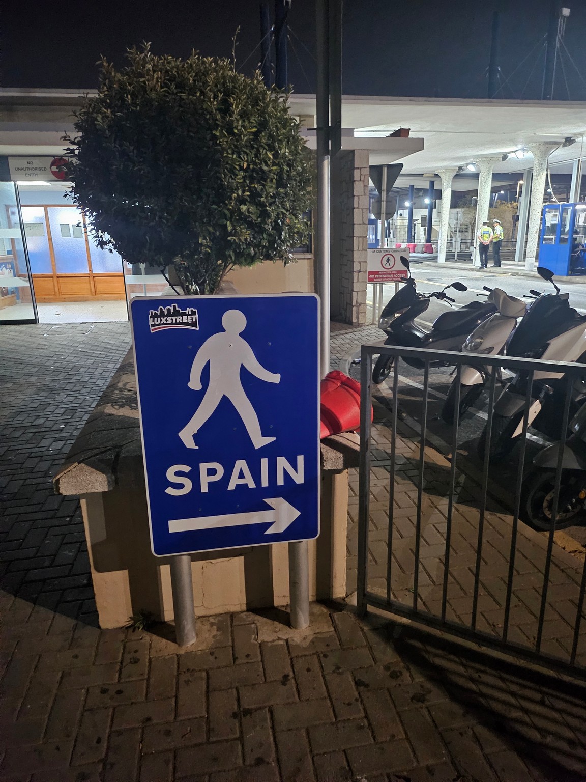 a blue sign with a person walking on it