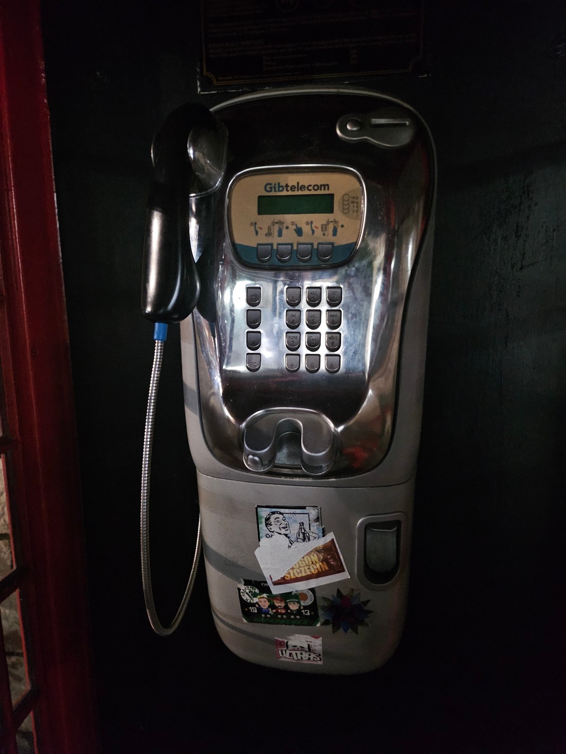 a pay phone on a wall