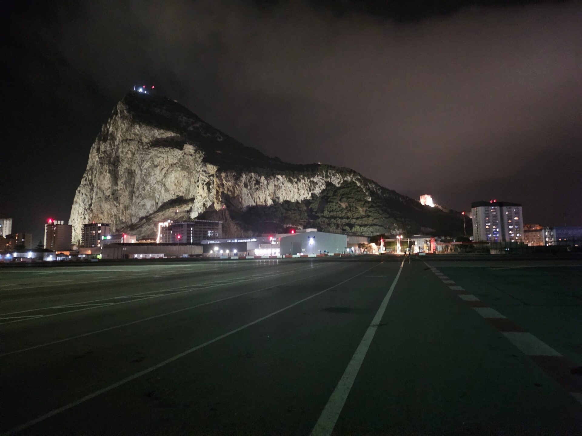 a road with a mountain in the background