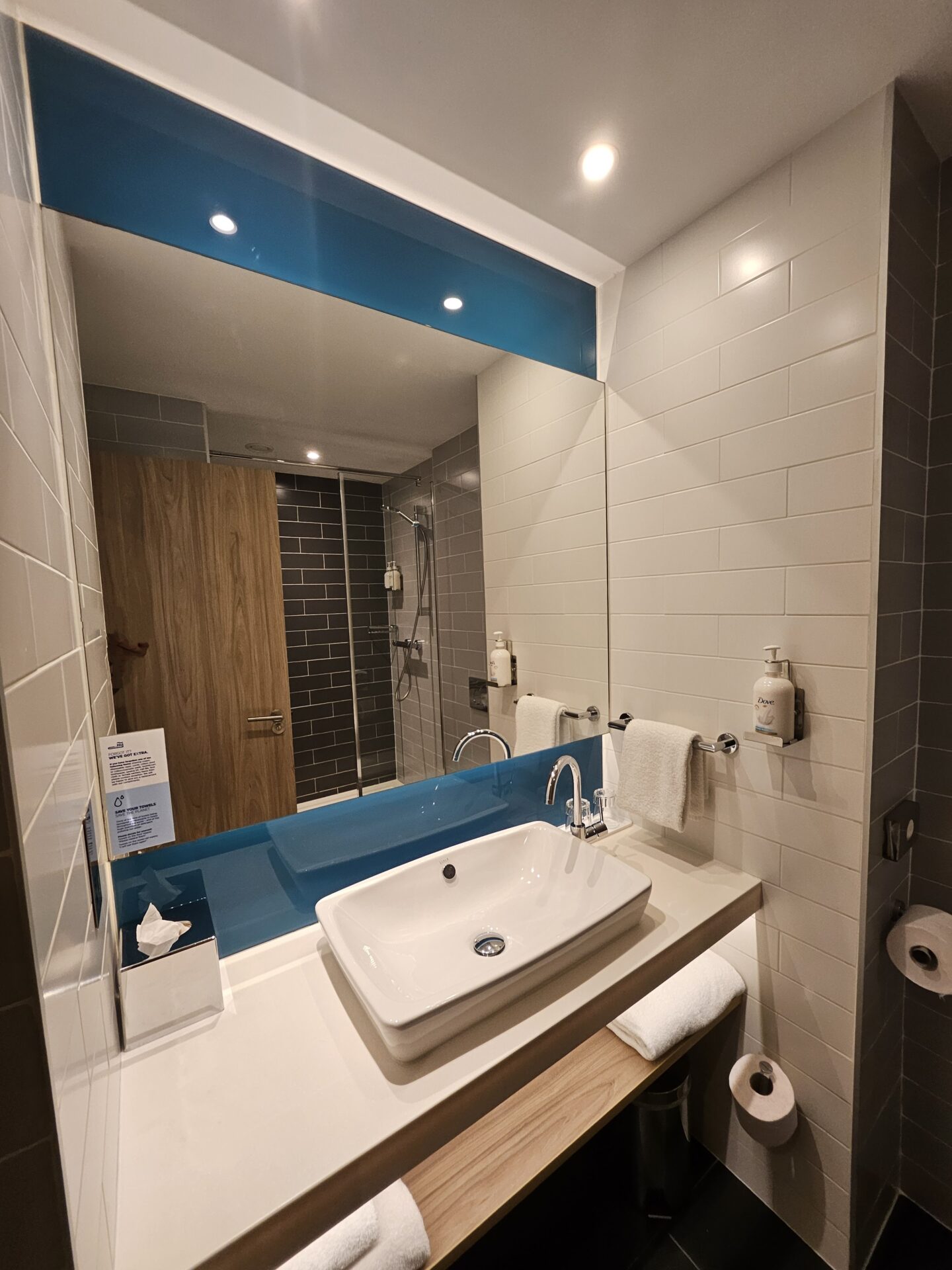 a bathroom with a sink and mirror