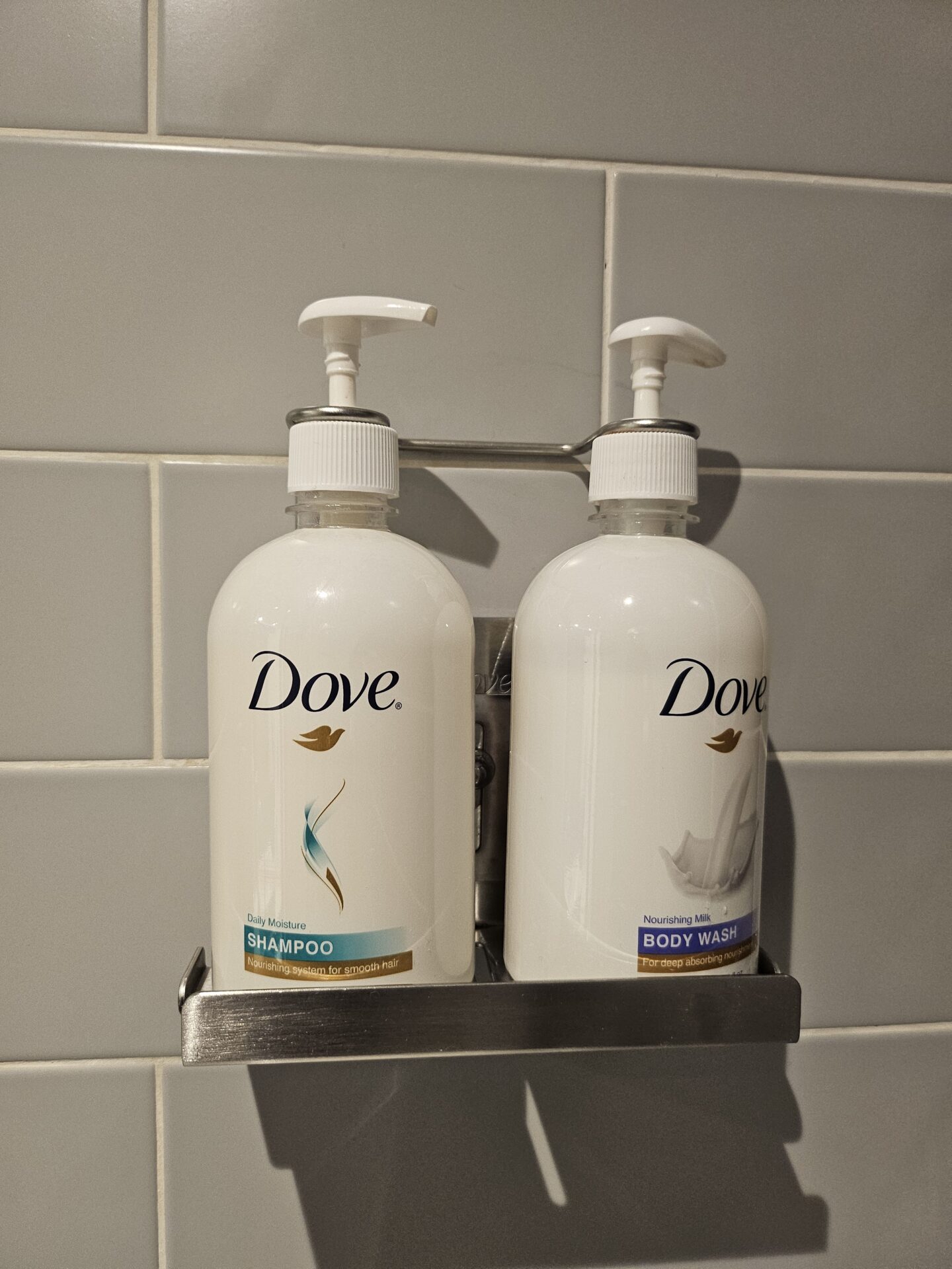 a group of soap dispensers on a shelf