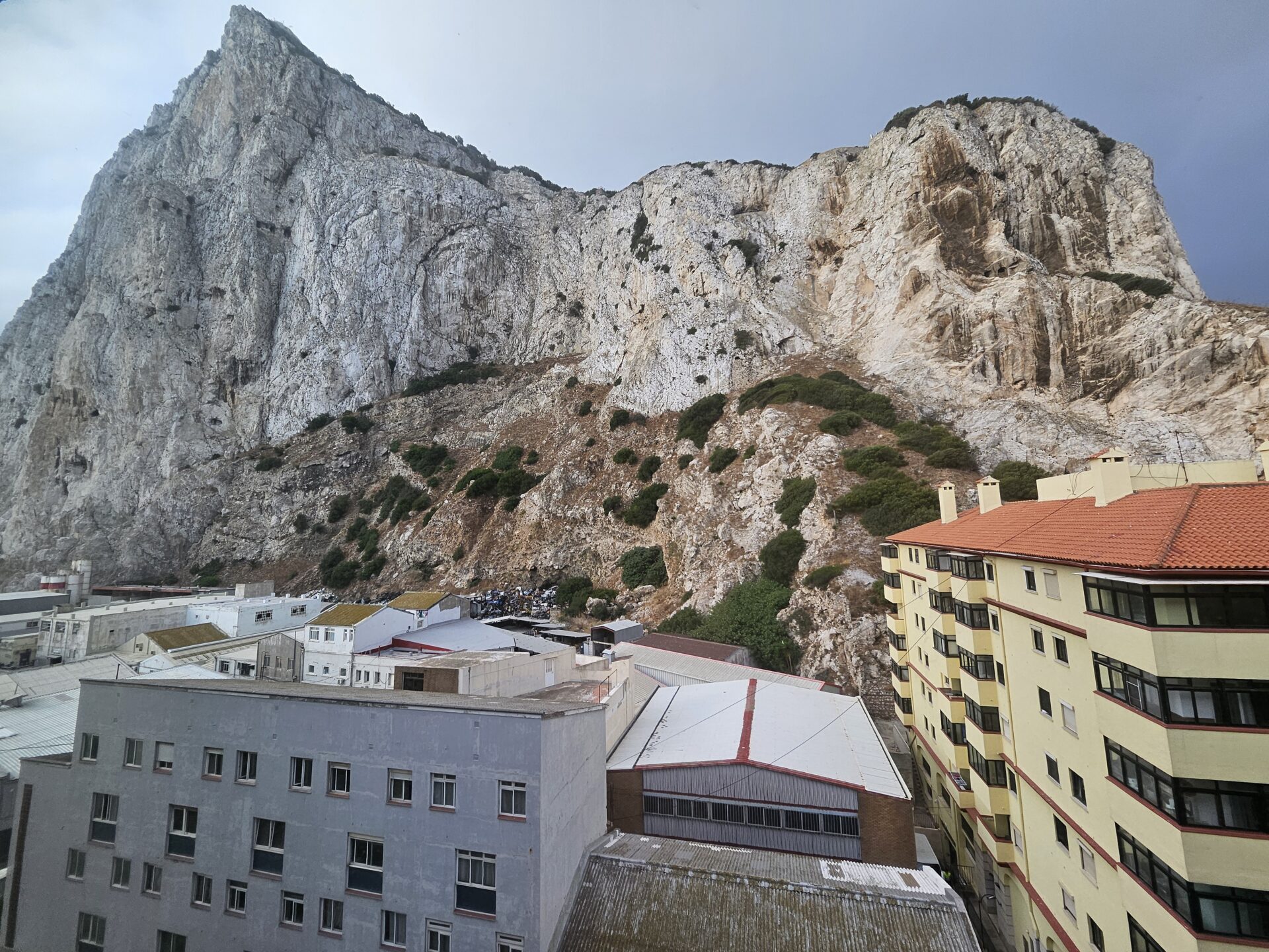 a mountain with buildings and trees