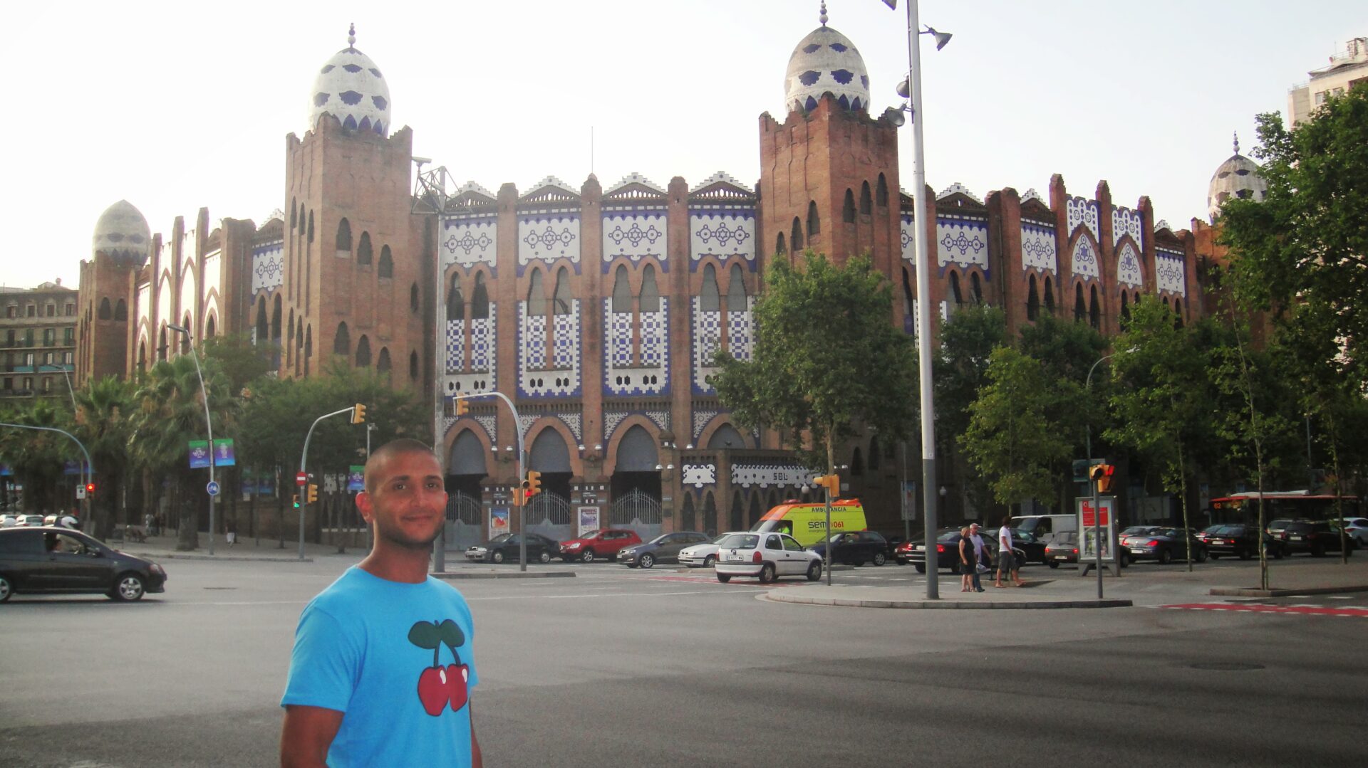 a man standing in front of a large building