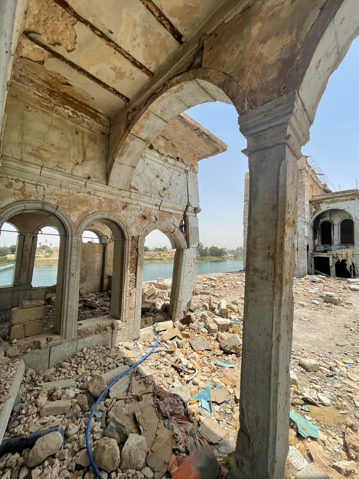 a building with many windows and a body of water