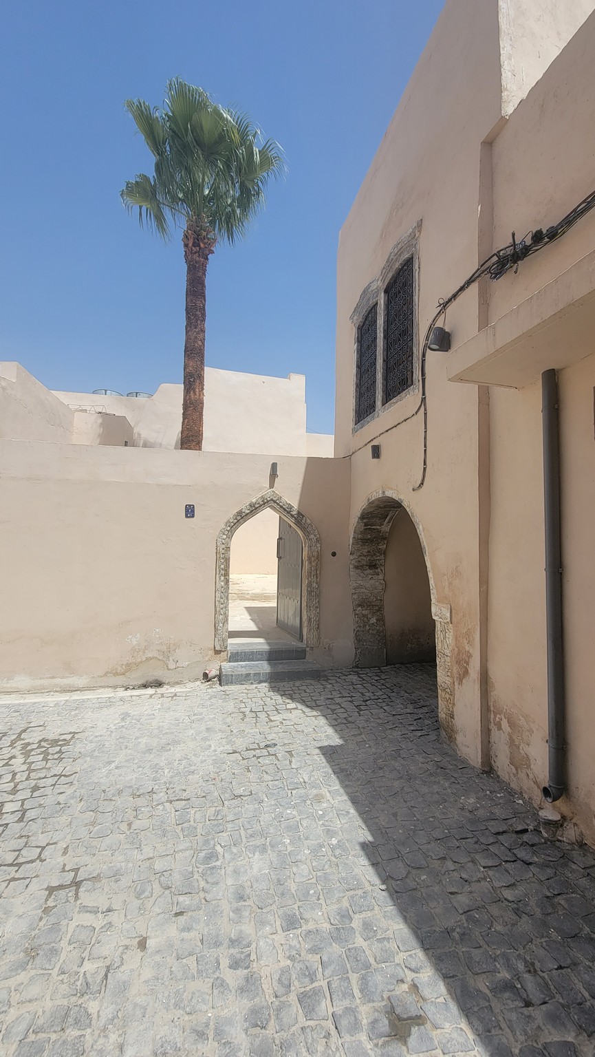 a building with a palm tree