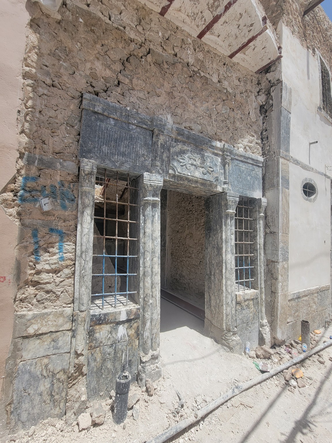 a stone building with a door and windows