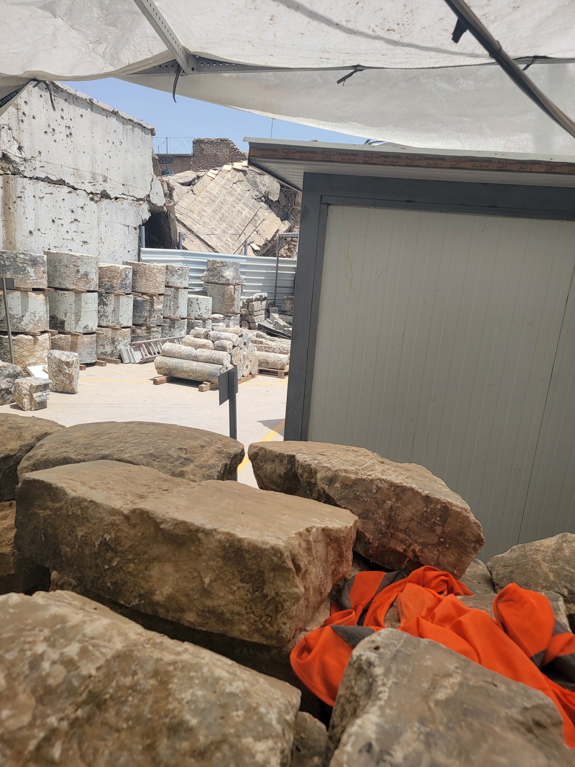 a pile of rocks and a building