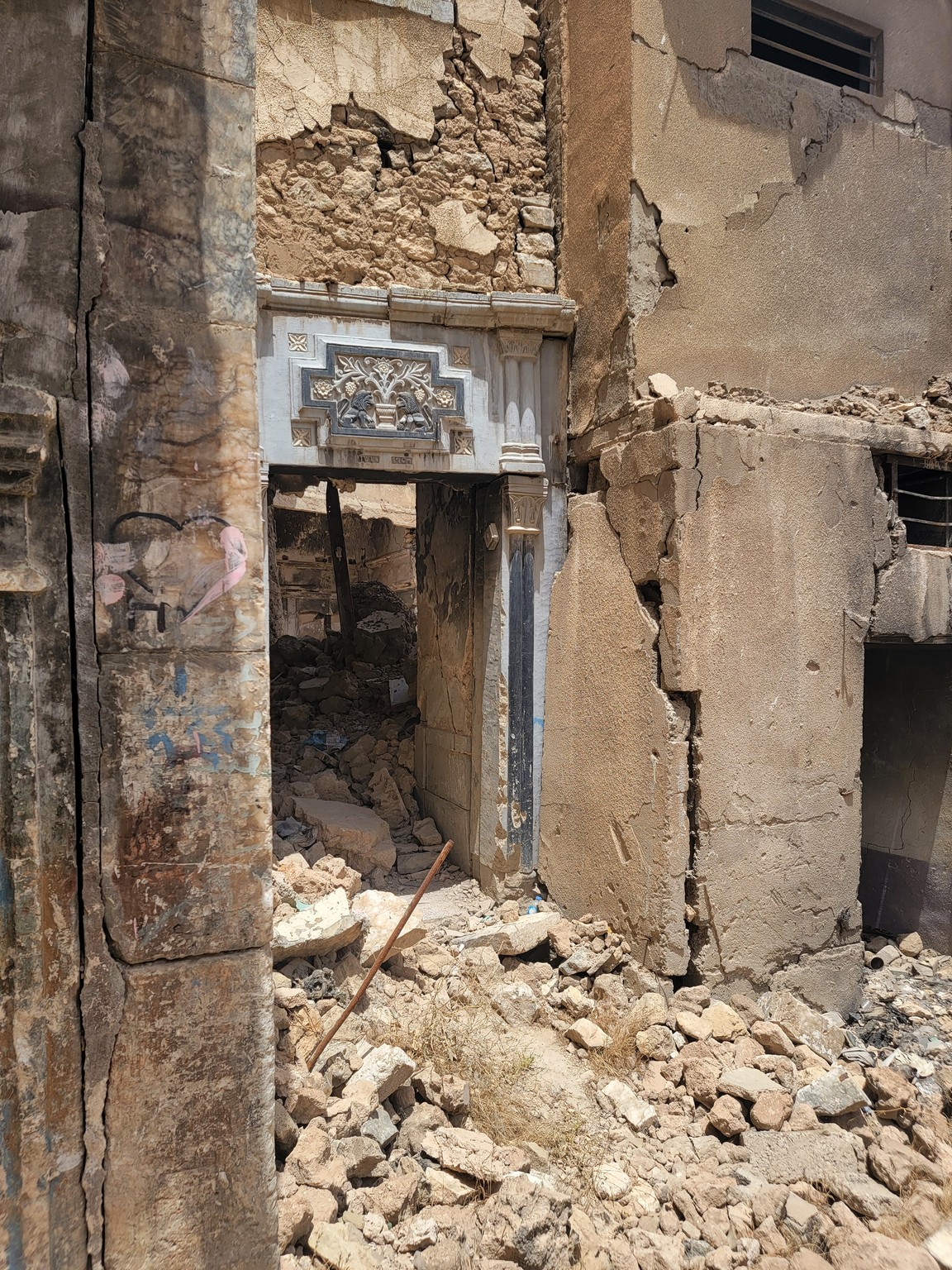 a stone doorway in a ruined building