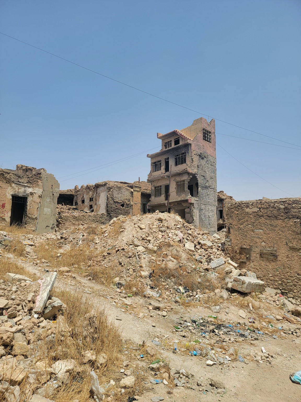 a destroyed building in a rocky area