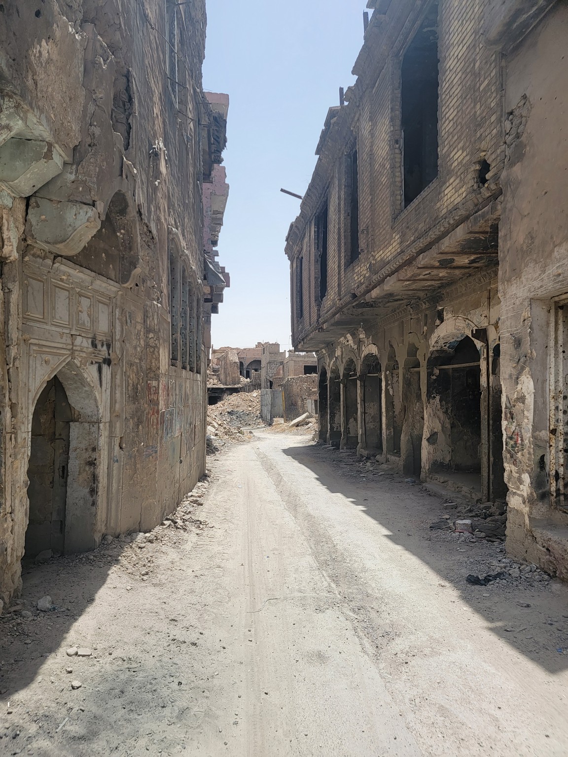 a street with buildings in the background