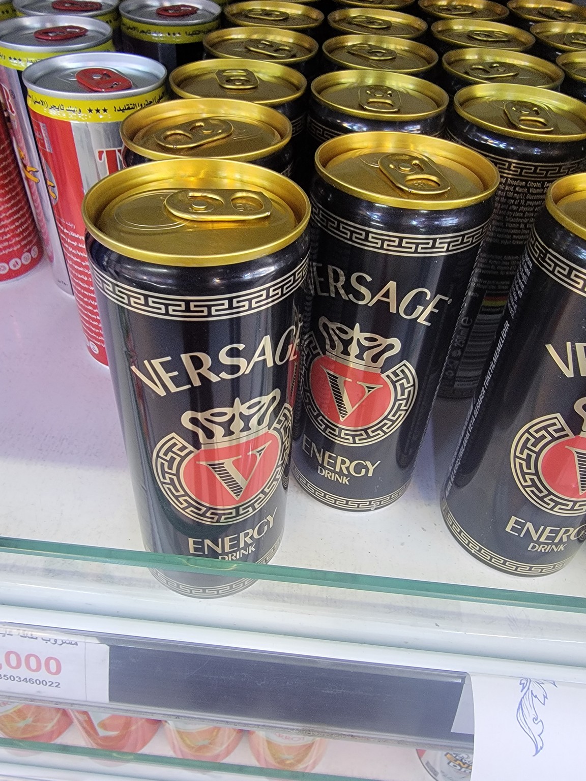 a group of black cans on a shelf