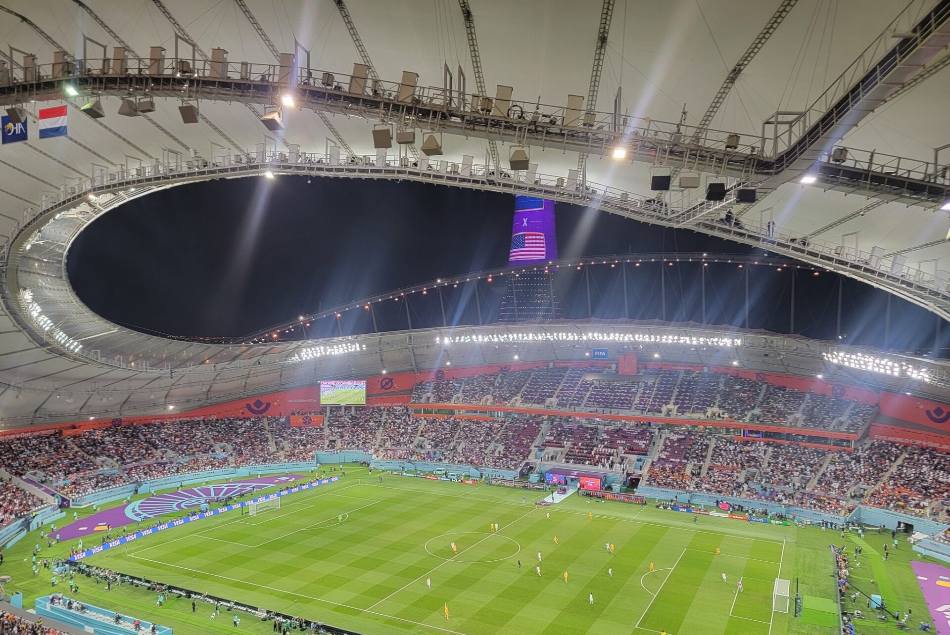 a stadium with a football field and people in the stands