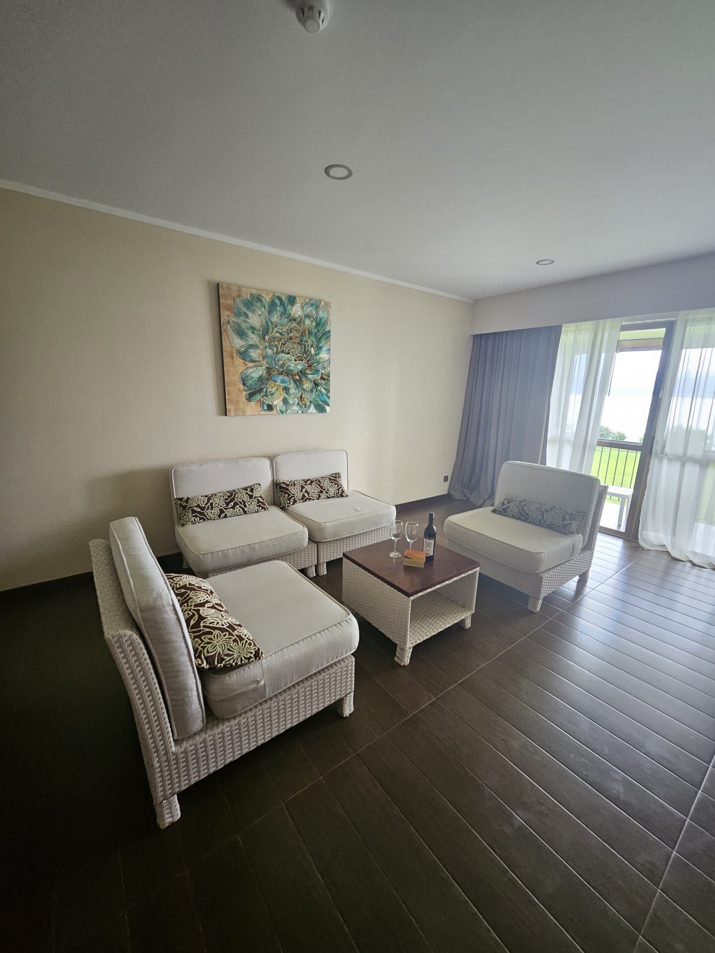 a room with white furniture and a table