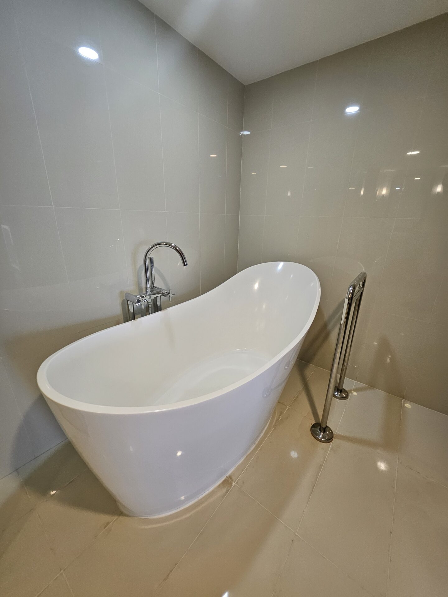 a white bathtub in a bathroom