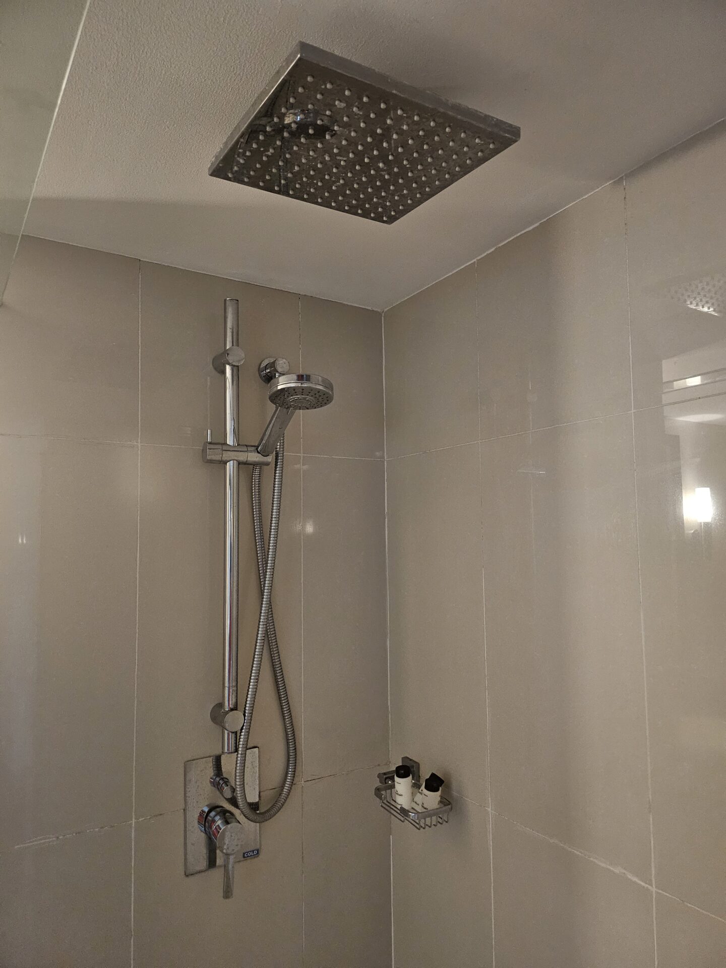 a shower head in a bathroom