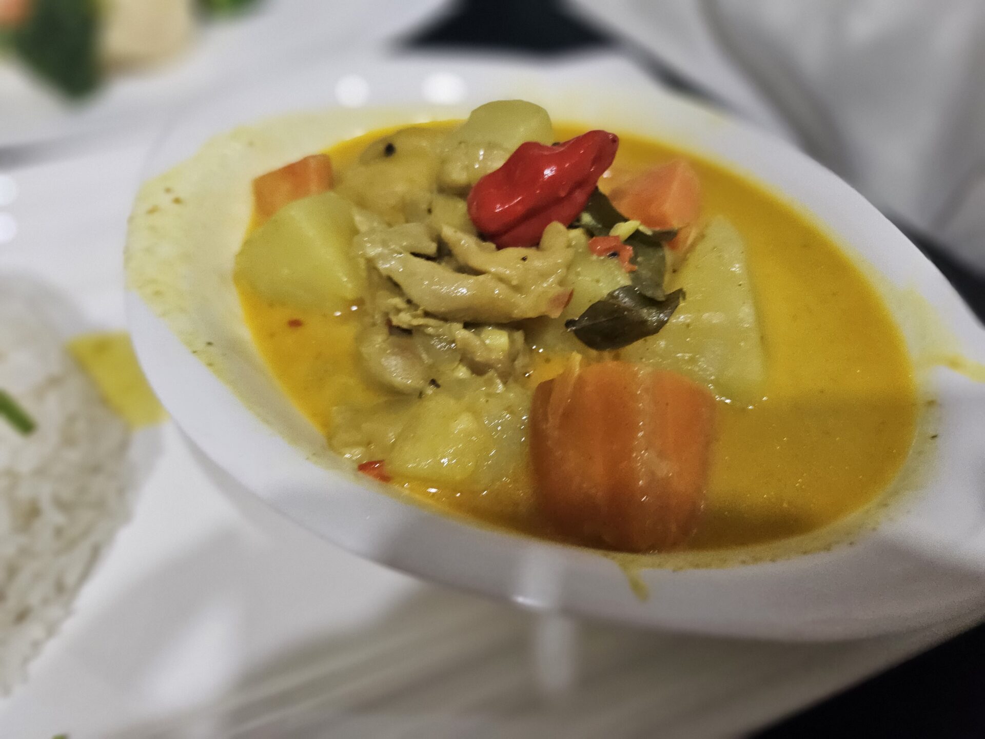 a bowl of soup with vegetables and meat