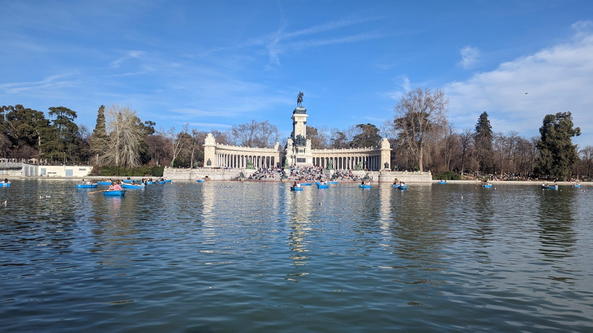 a group of people in boats in a body of water