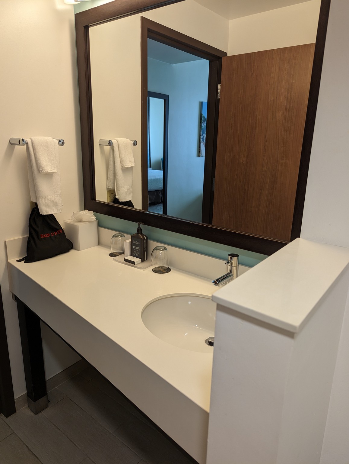 a bathroom with a mirror and sink