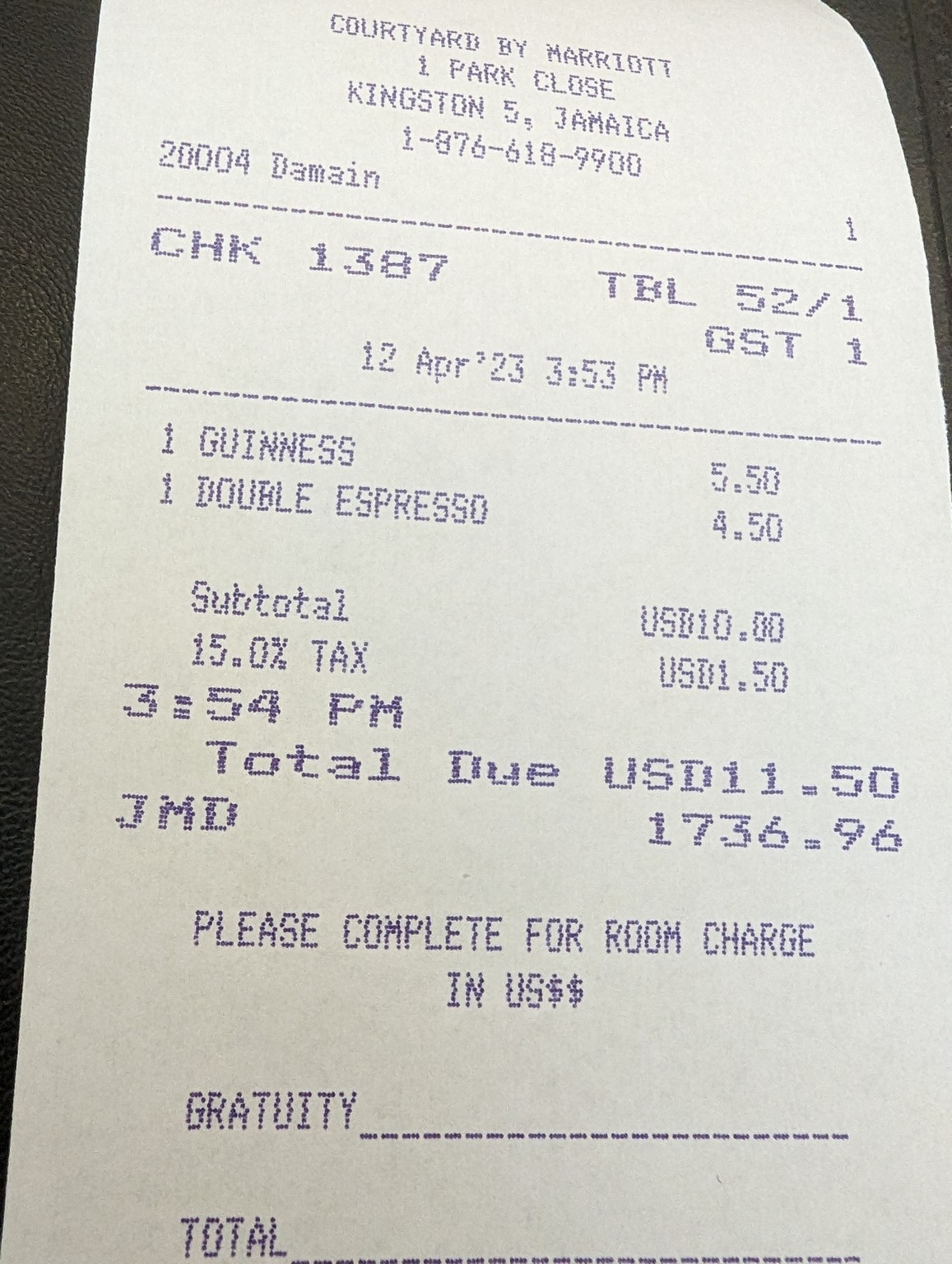 a receipt on a leather surface