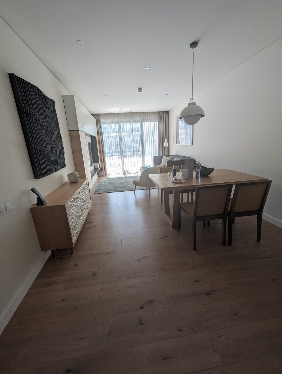 a dining table and chairs in a room