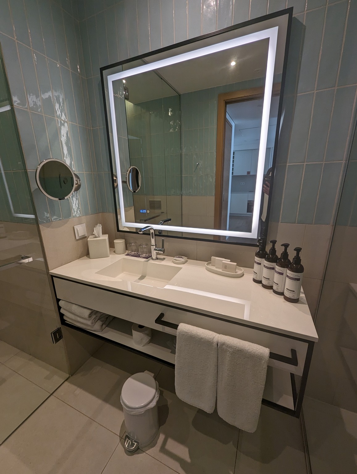 a bathroom with a mirror and a sink