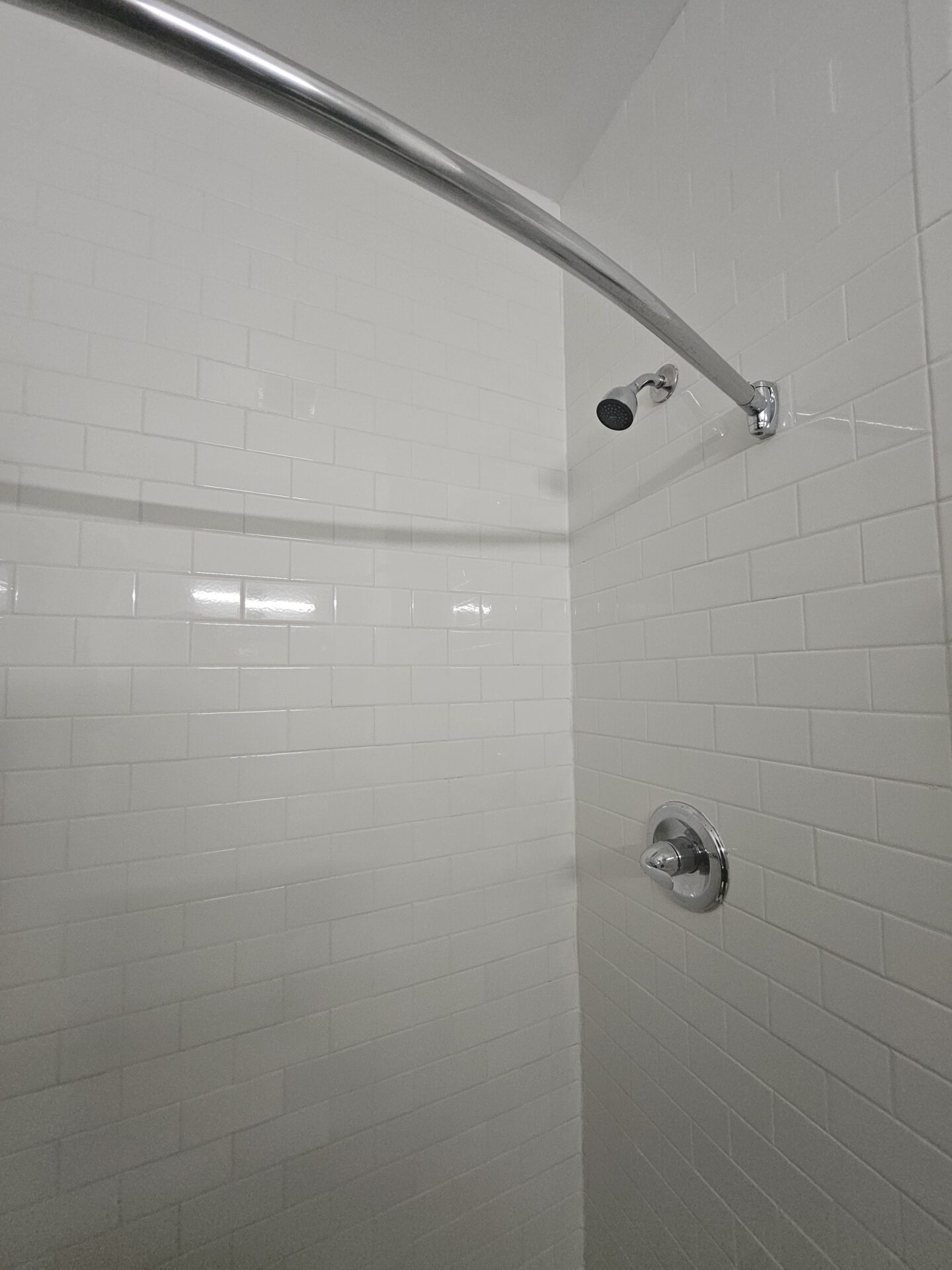 a shower head in a bathroom