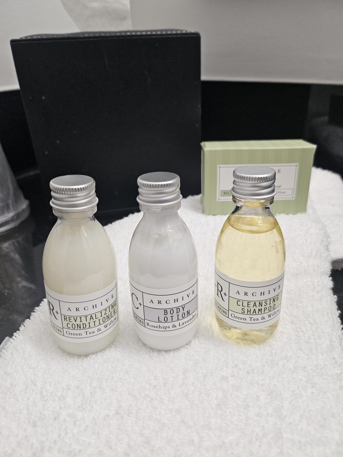 a group of small bottles on a towel