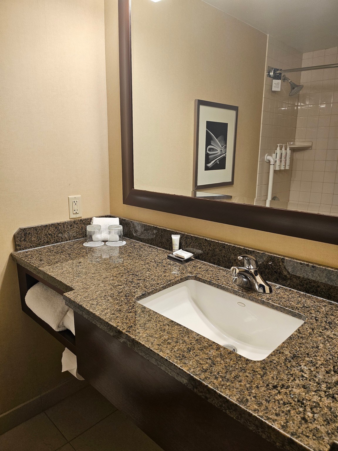 a bathroom with a mirror and sink