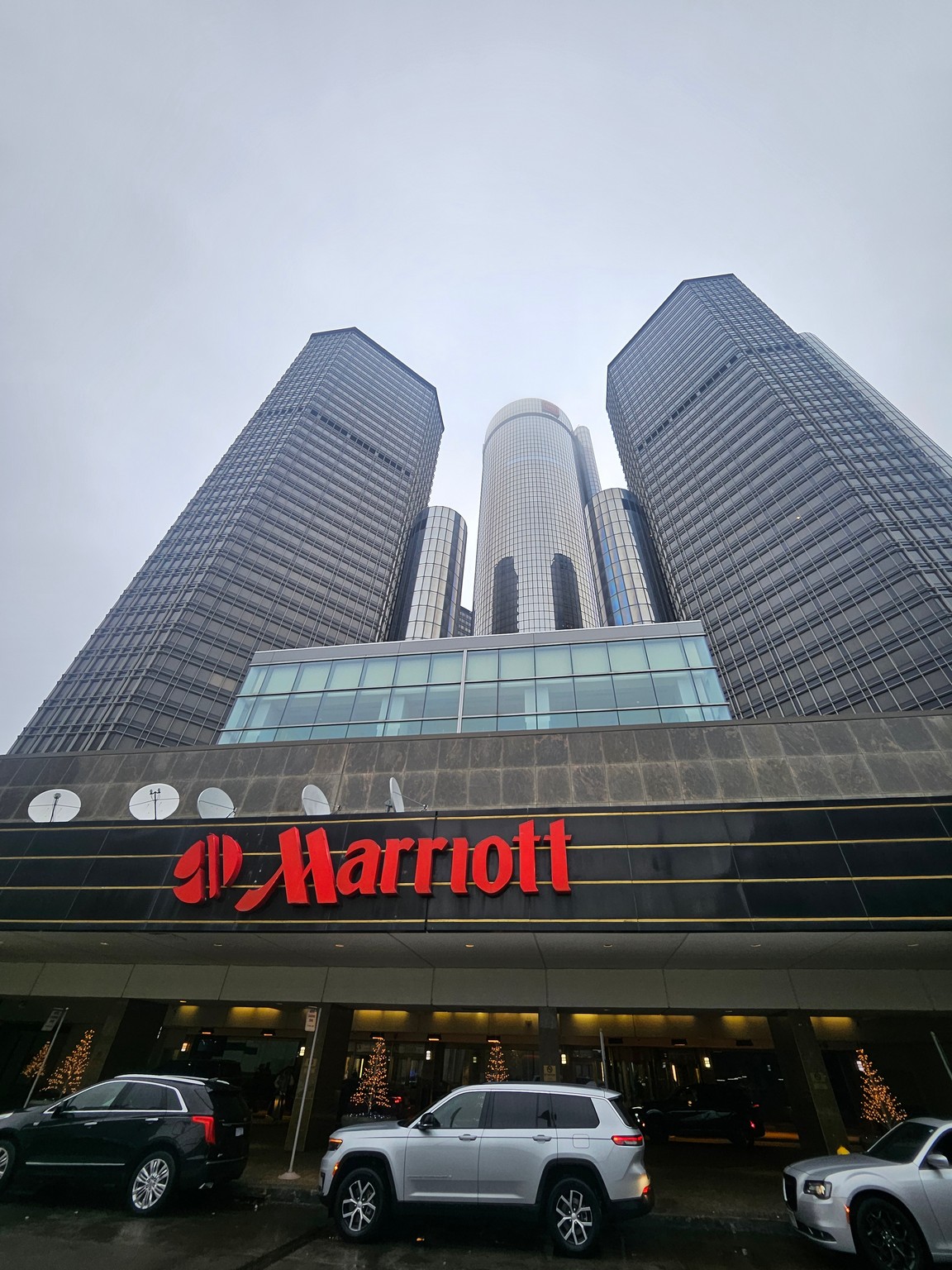 a group of tall buildings with a sign