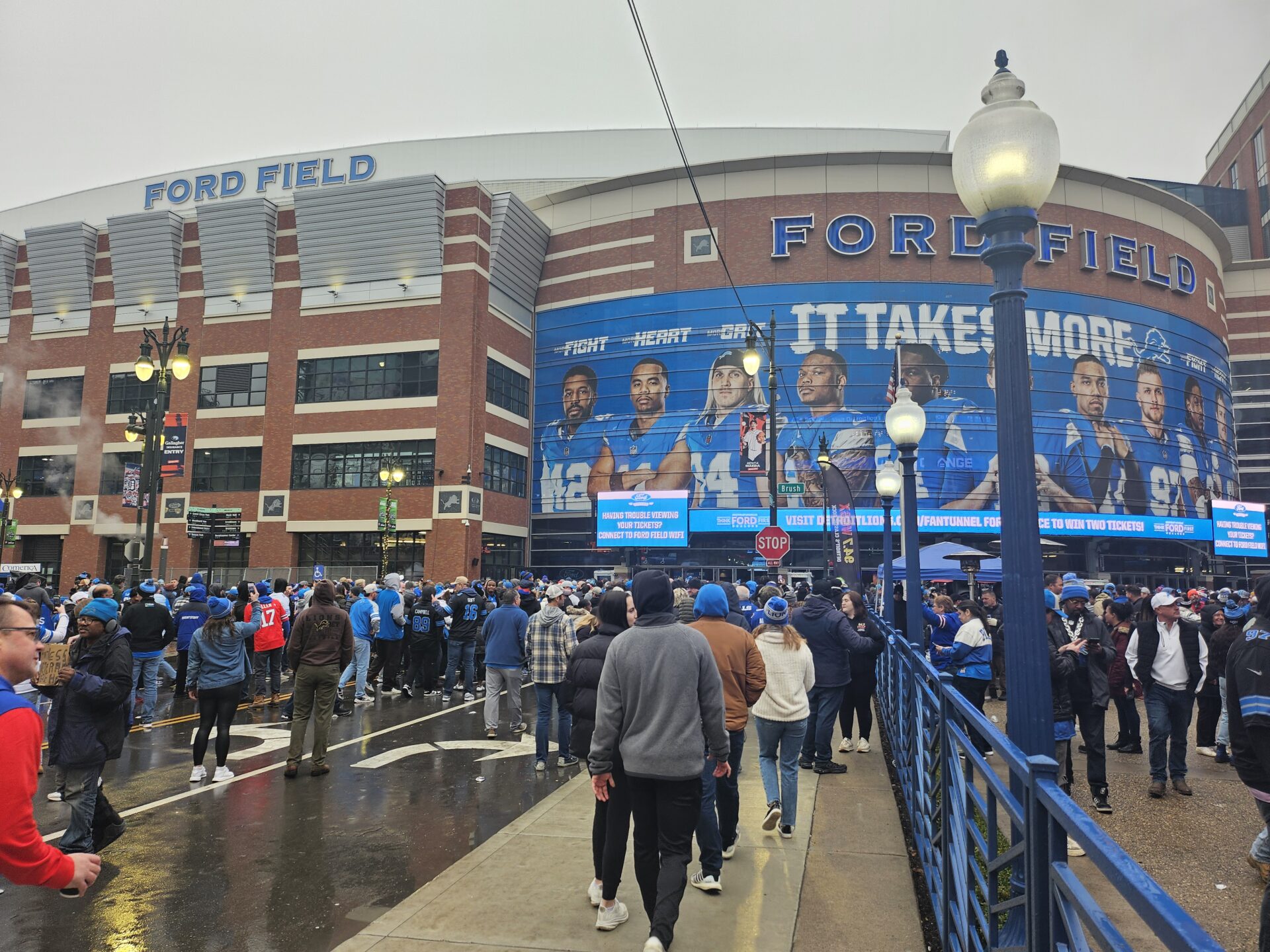 a crowd of people outside a stadium