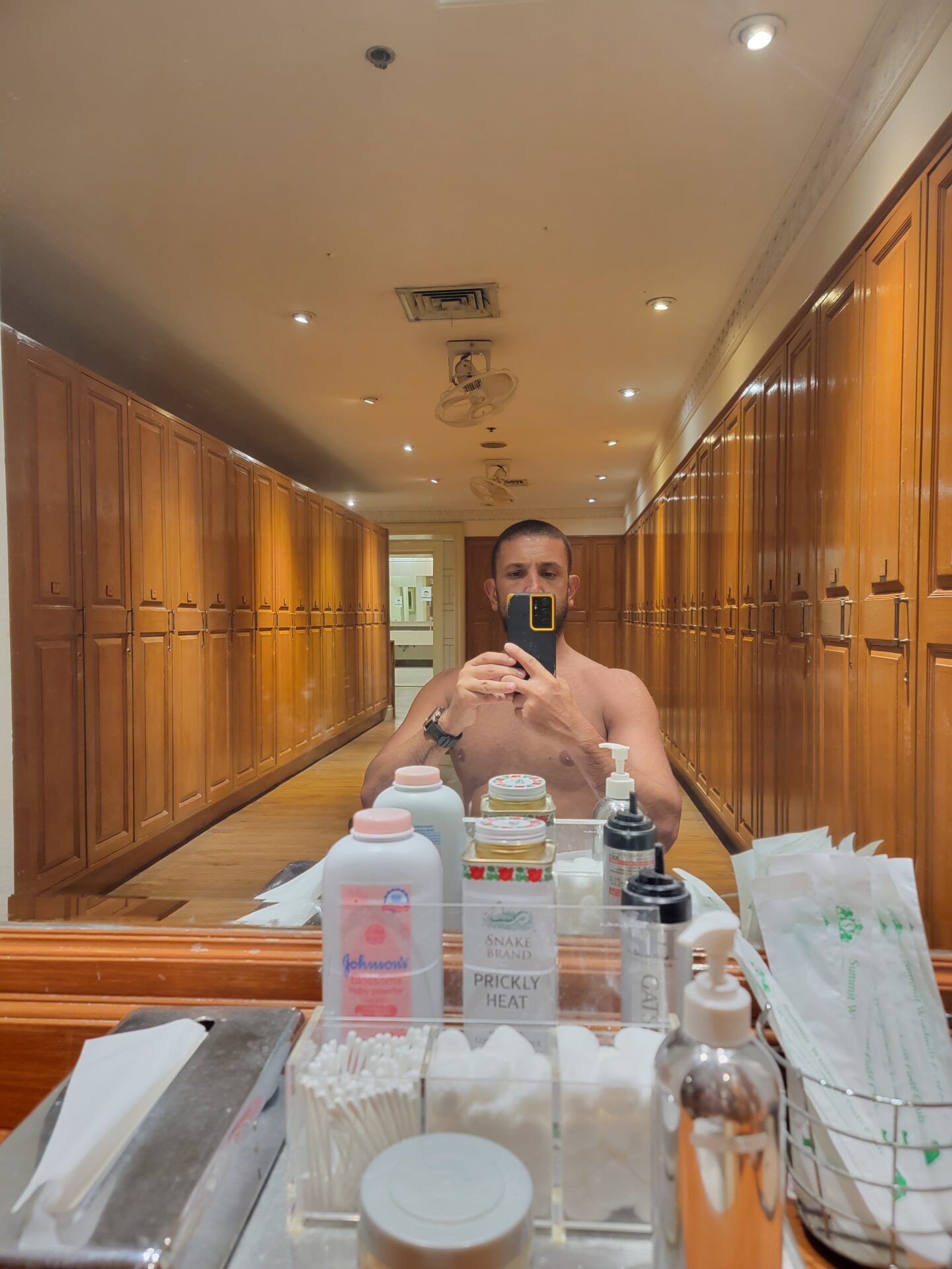 a man taking a selfie in a mirror