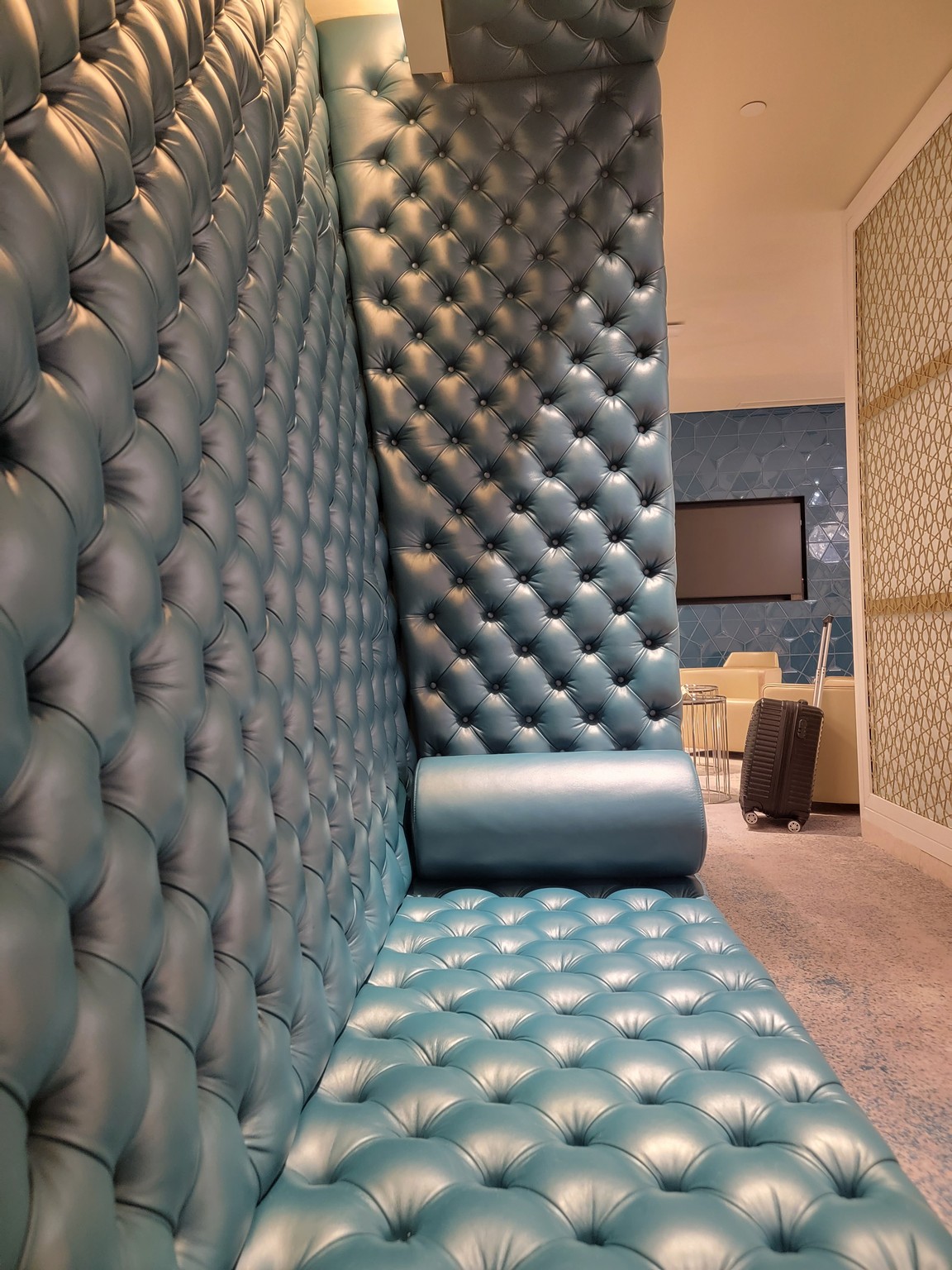 a blue leather couch in a room